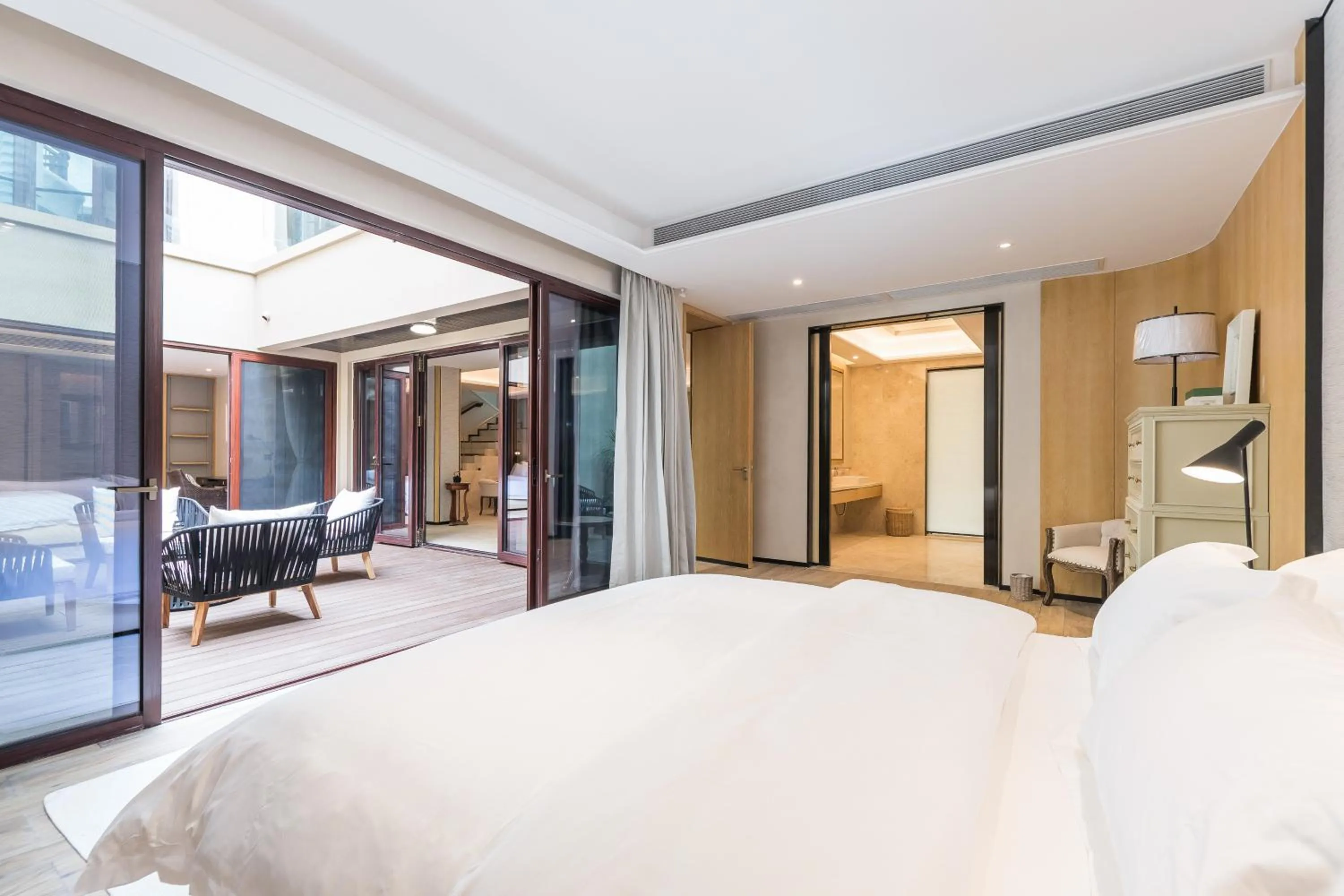 Bed in HaitangBay Loosen Coast Resort Villas