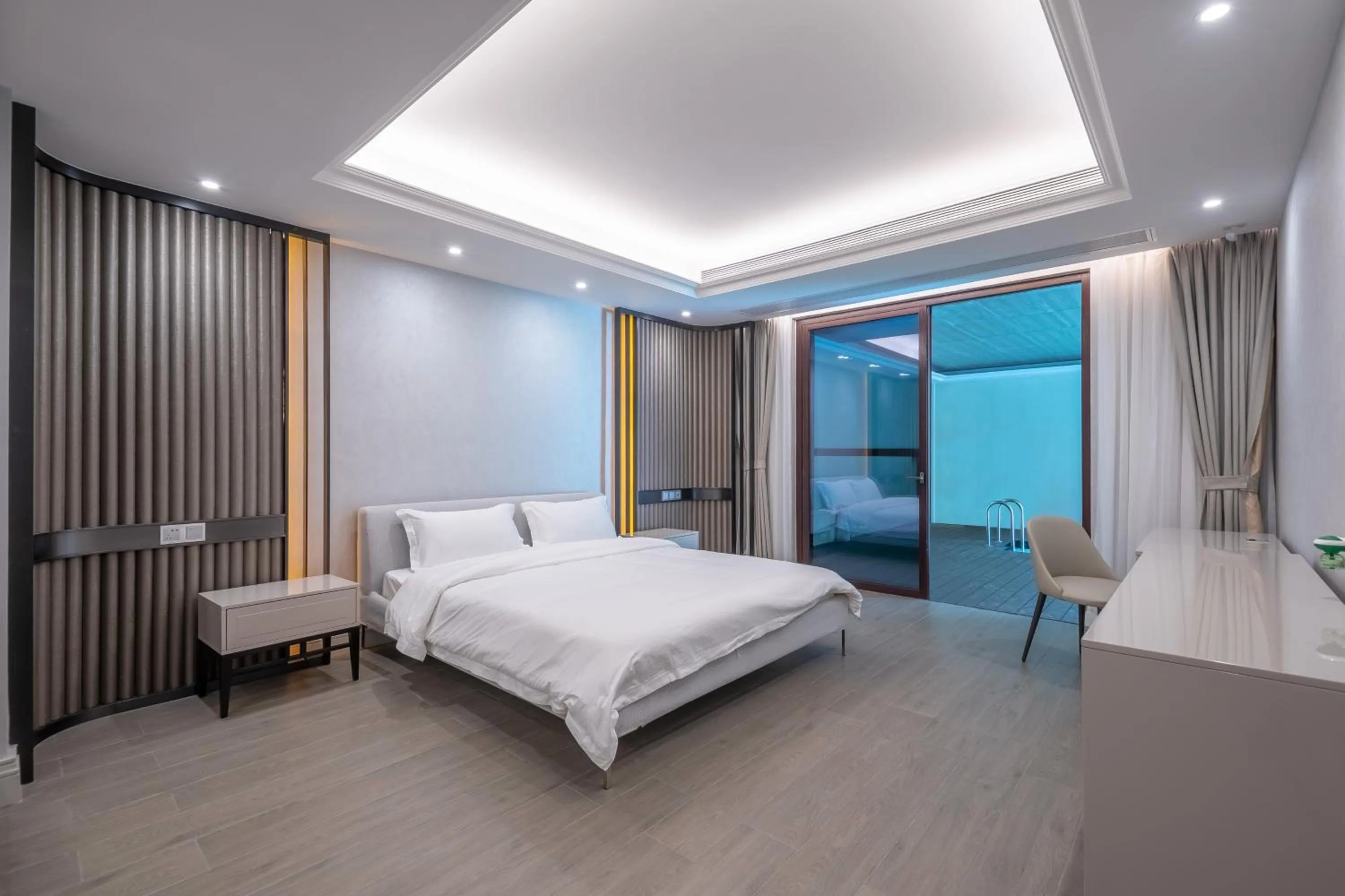 Bed in HaitangBay Loosen Coast Resort Villas