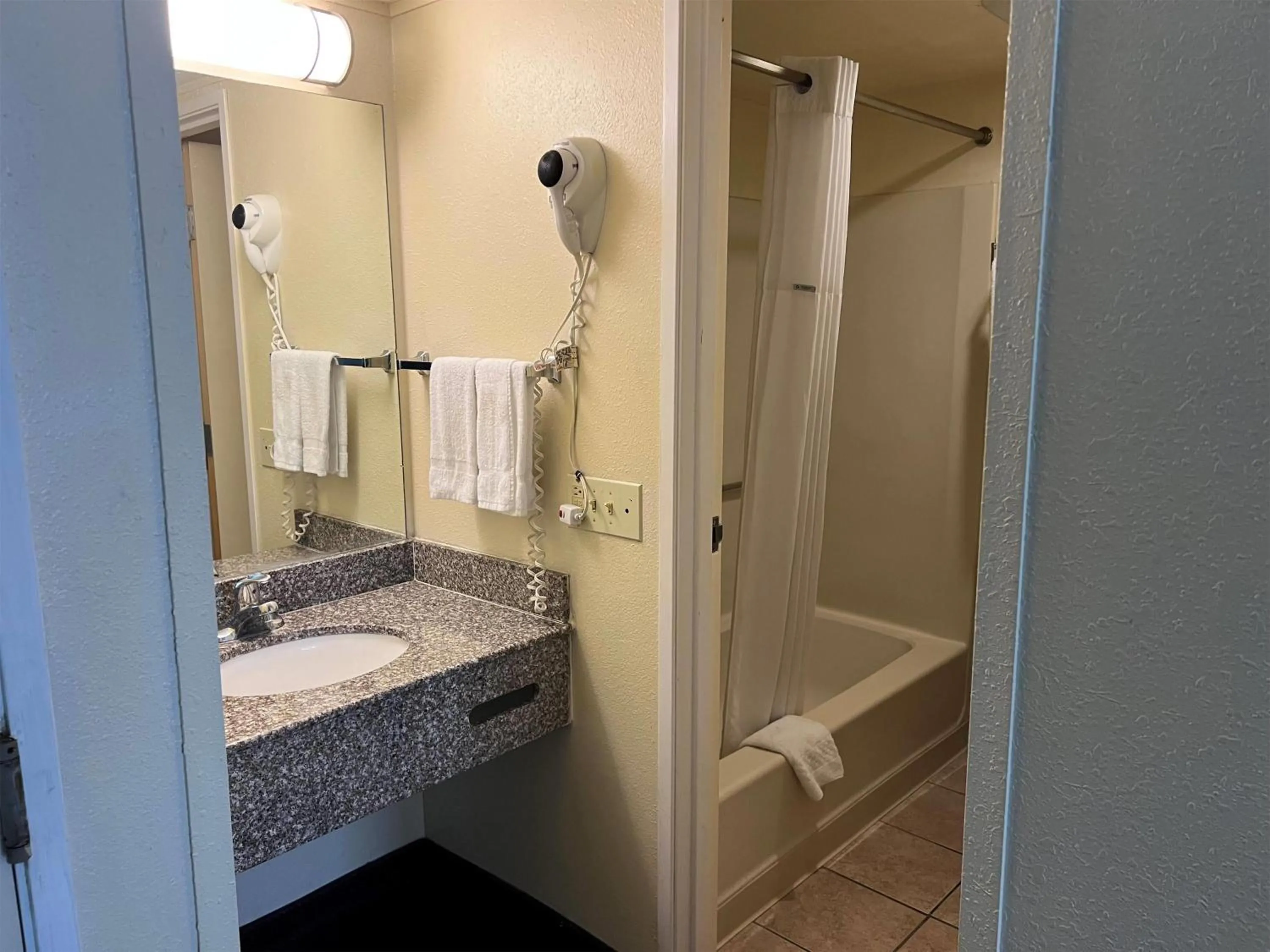 Bathroom in Days Inn by Wyndham Southern Hills/ORU