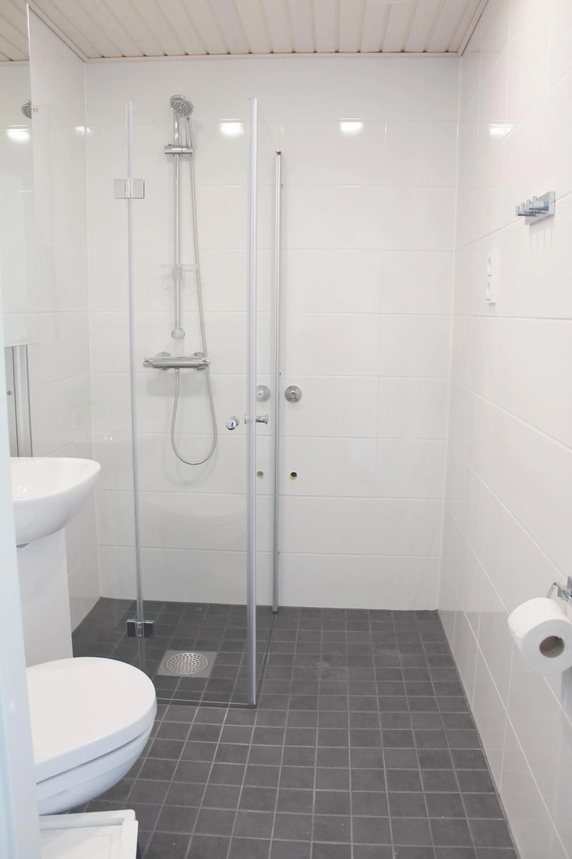 Shower in Forenom Serviced Apartments Rovaniemi Valtakatu