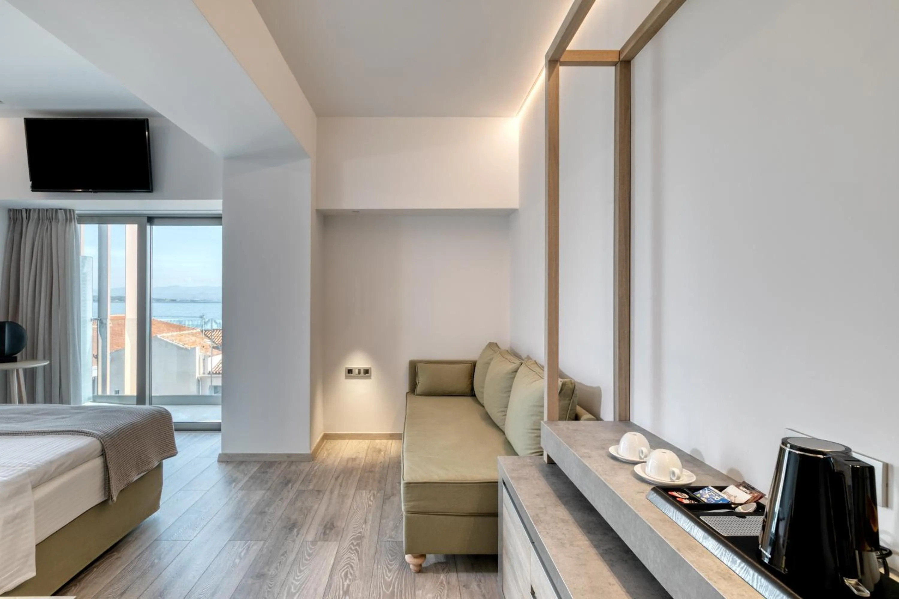 Seating area, Bed in LAS HOTEL & SPA