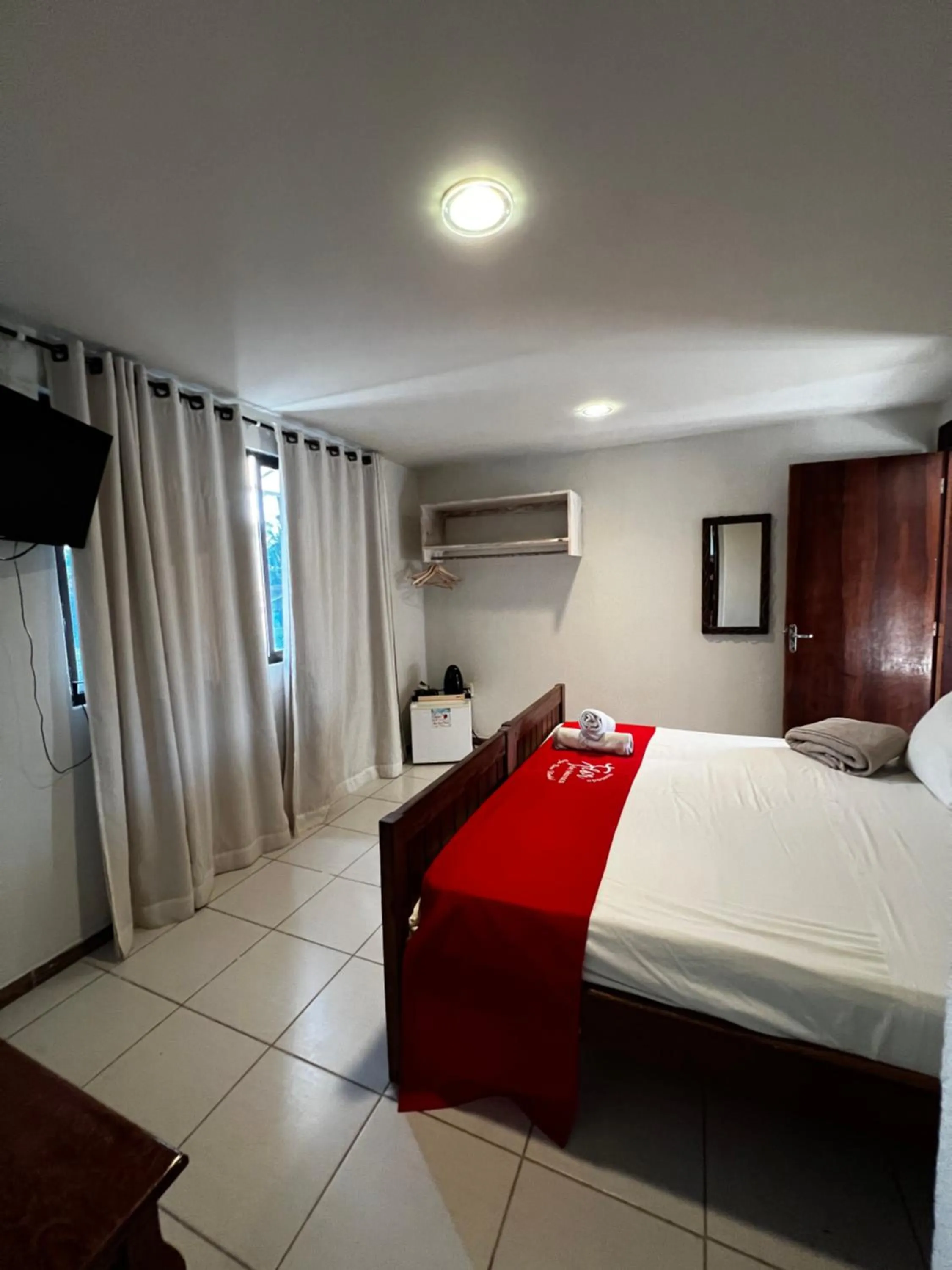 Bed in Pousada Flor de Maraca