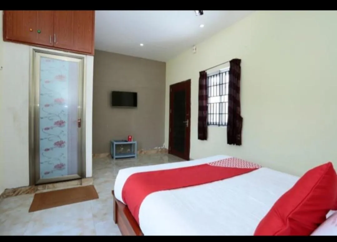 Bed in Sushmika Resorts Inn