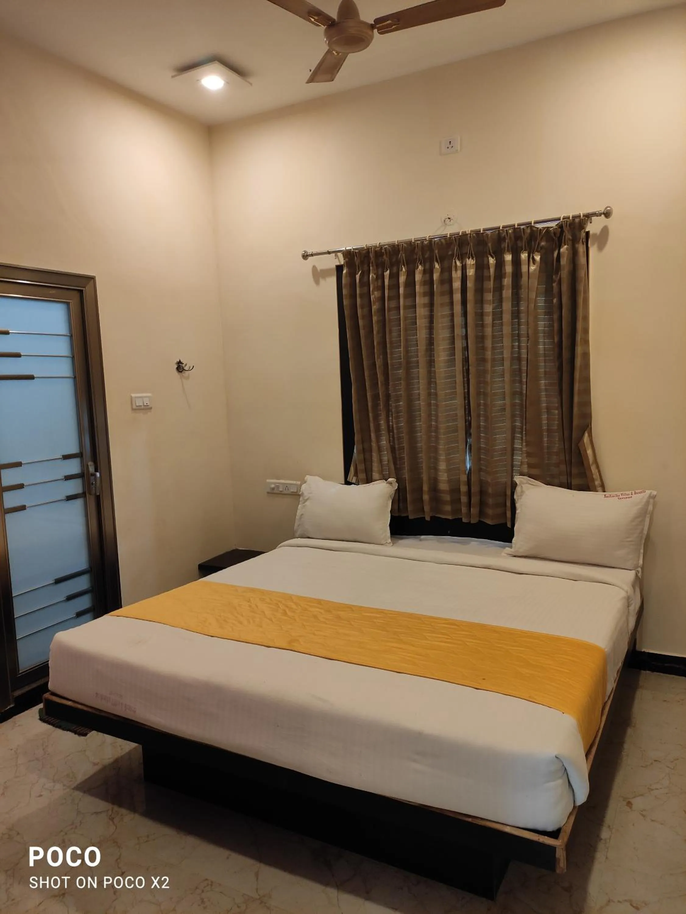 Bed in Sushmika Resorts Inn