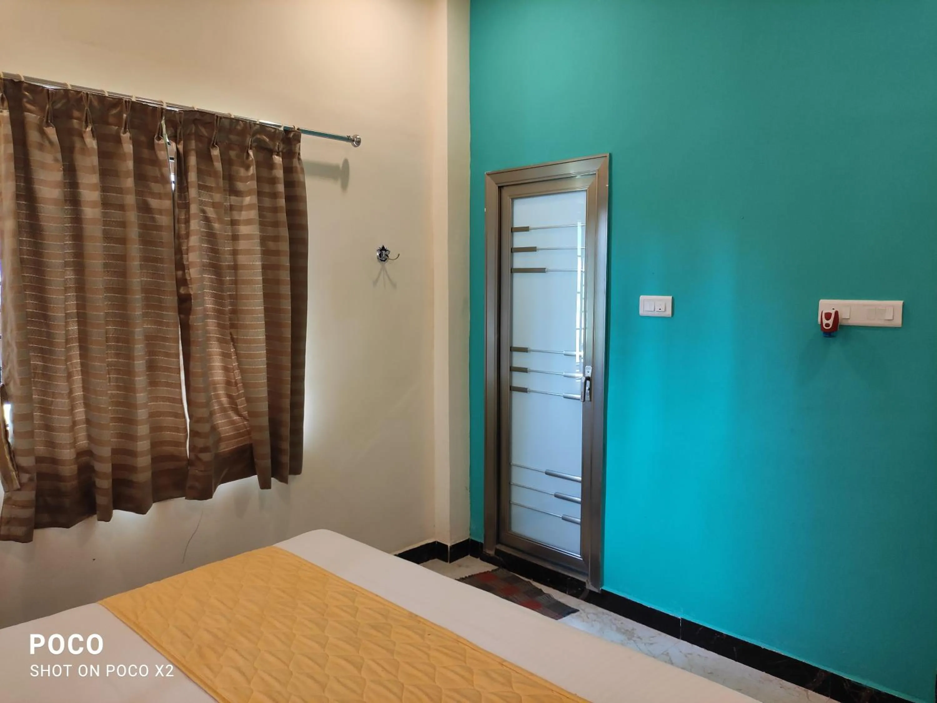 Bed in Sushmika Resorts Inn