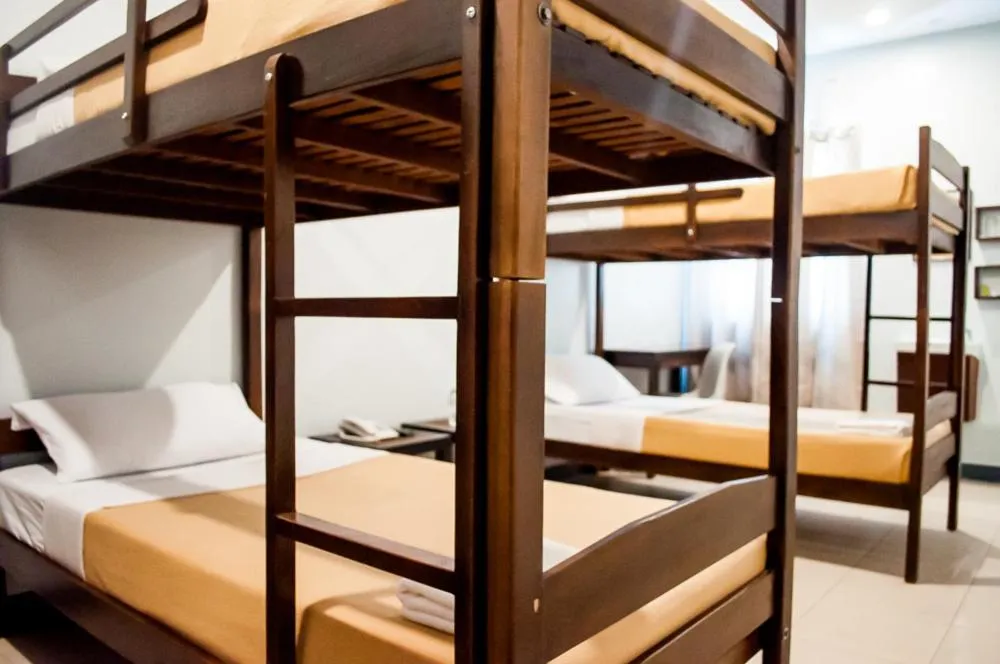 Bed in Seasons Hotel Sablayan