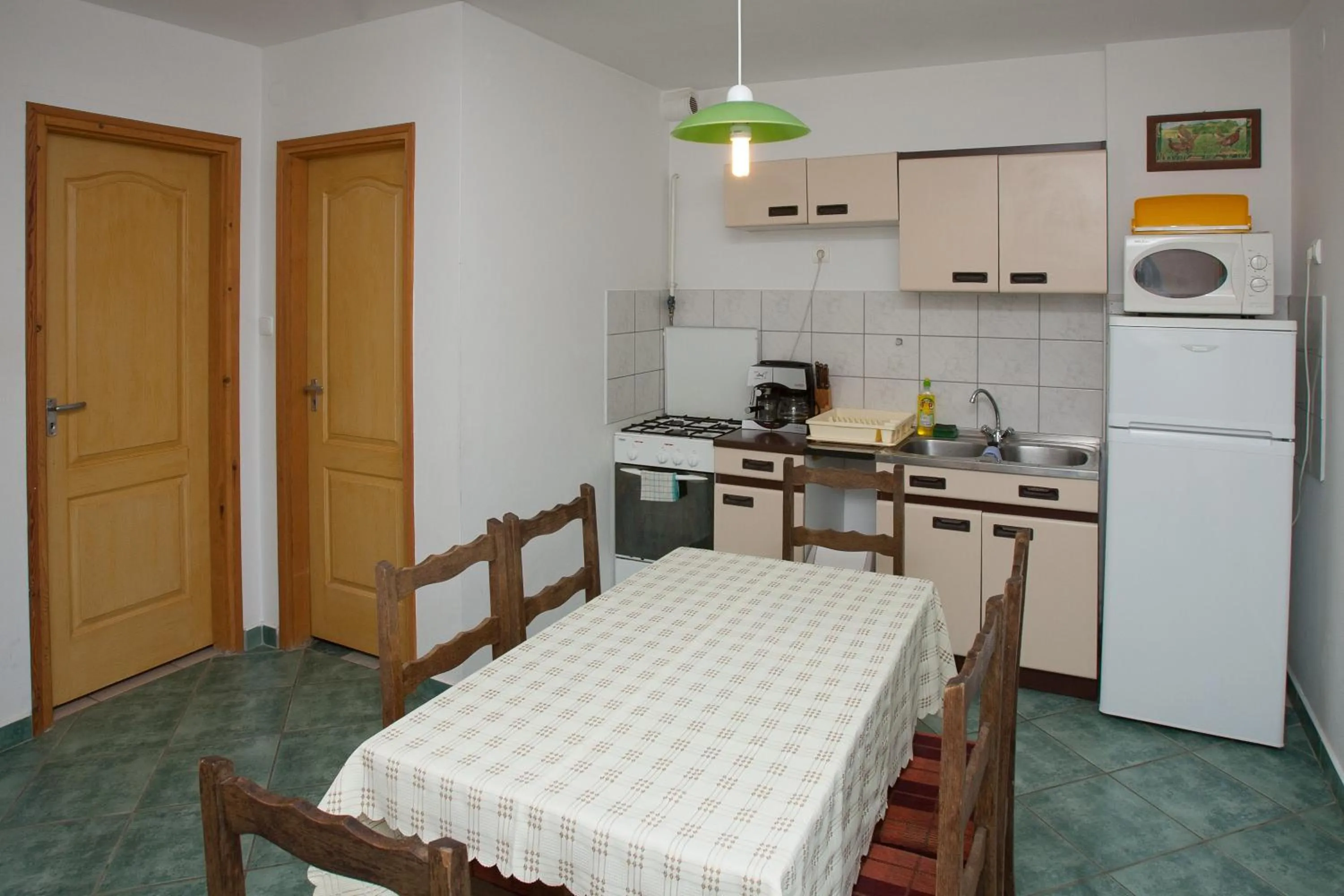 Kitchen or kitchenette in Páratlan Apartmanház