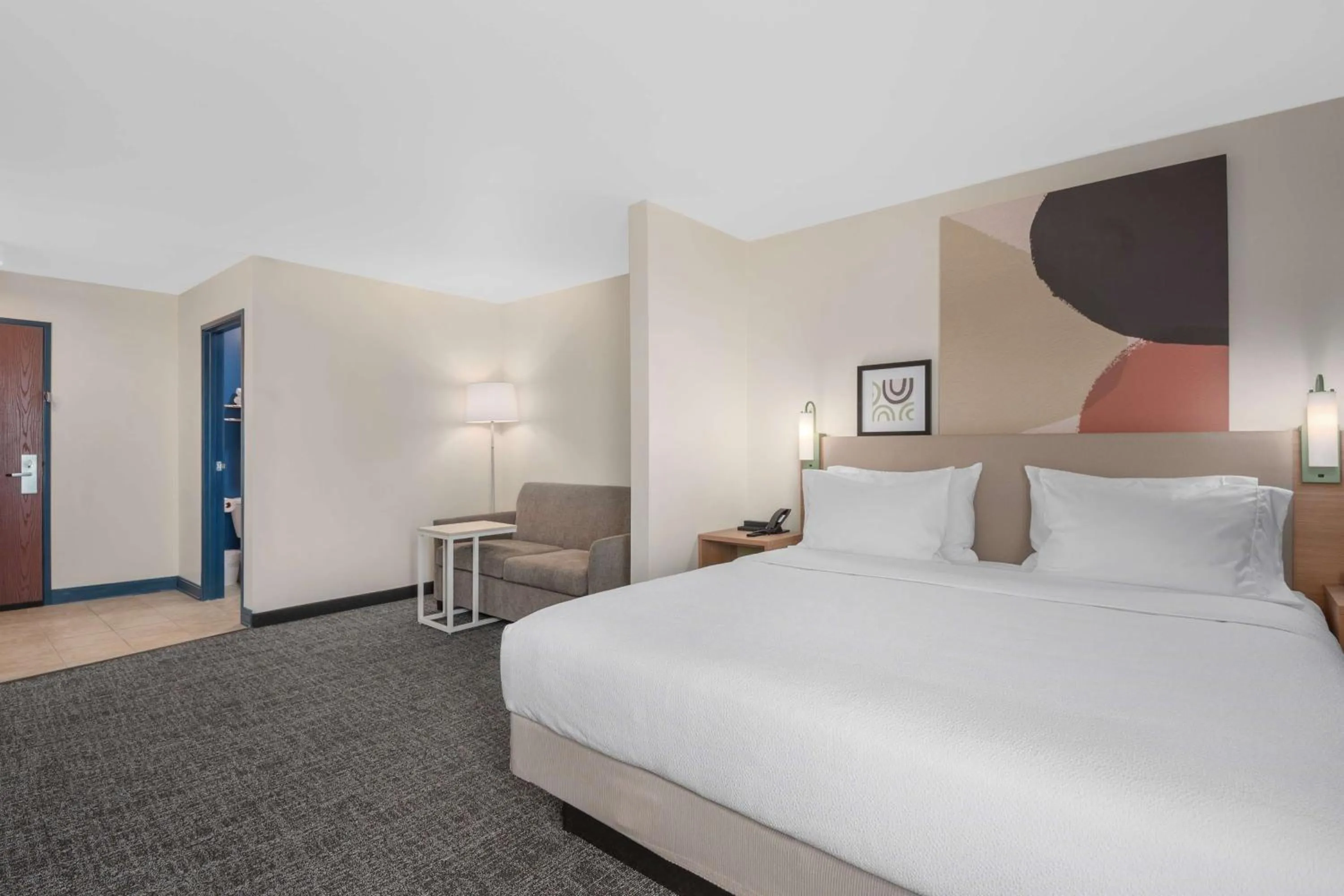 Living room, Bed in Sierra Inn Minot