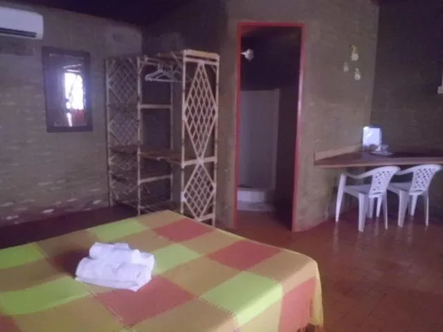 Bed in Chalemar Hotel Pousada