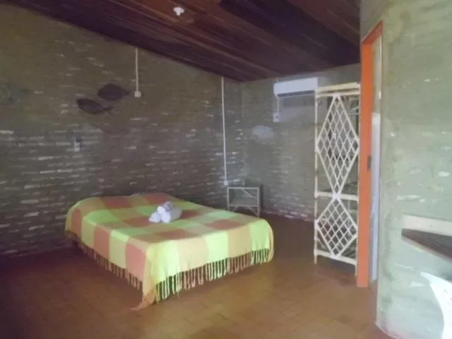 Bed in Chalemar Hotel Pousada