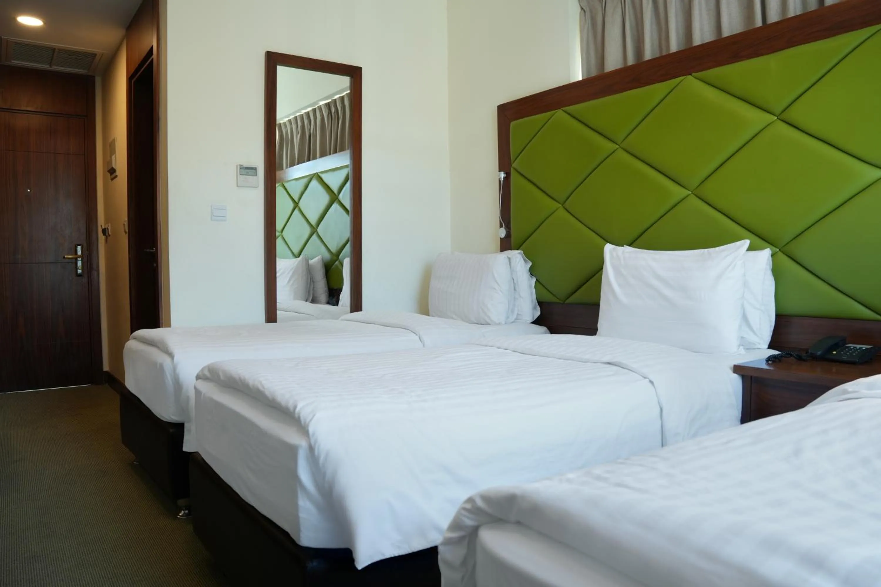 Bed in Holyland Hotel Amman