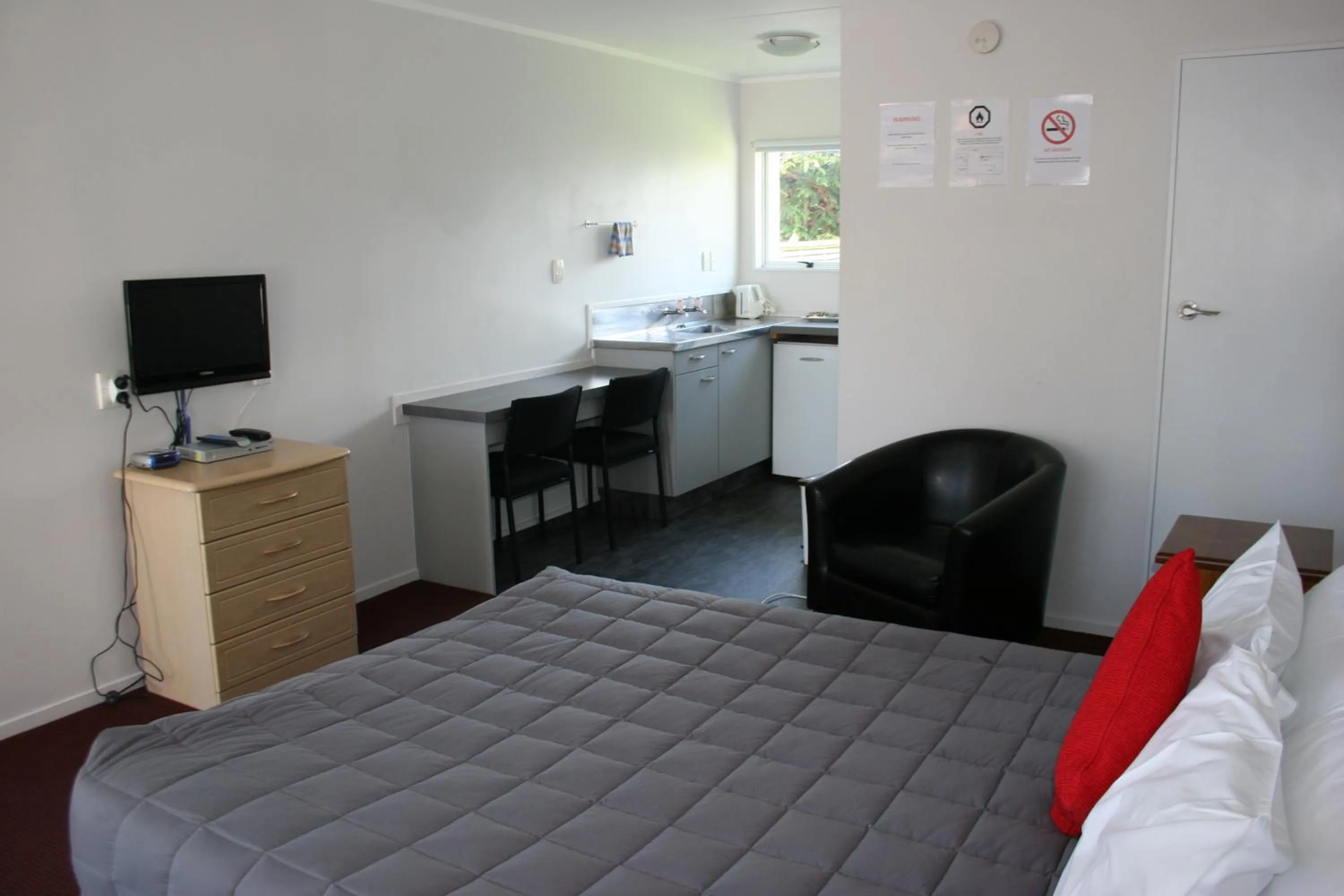 Day, Bed in Burgundy Rose Motel