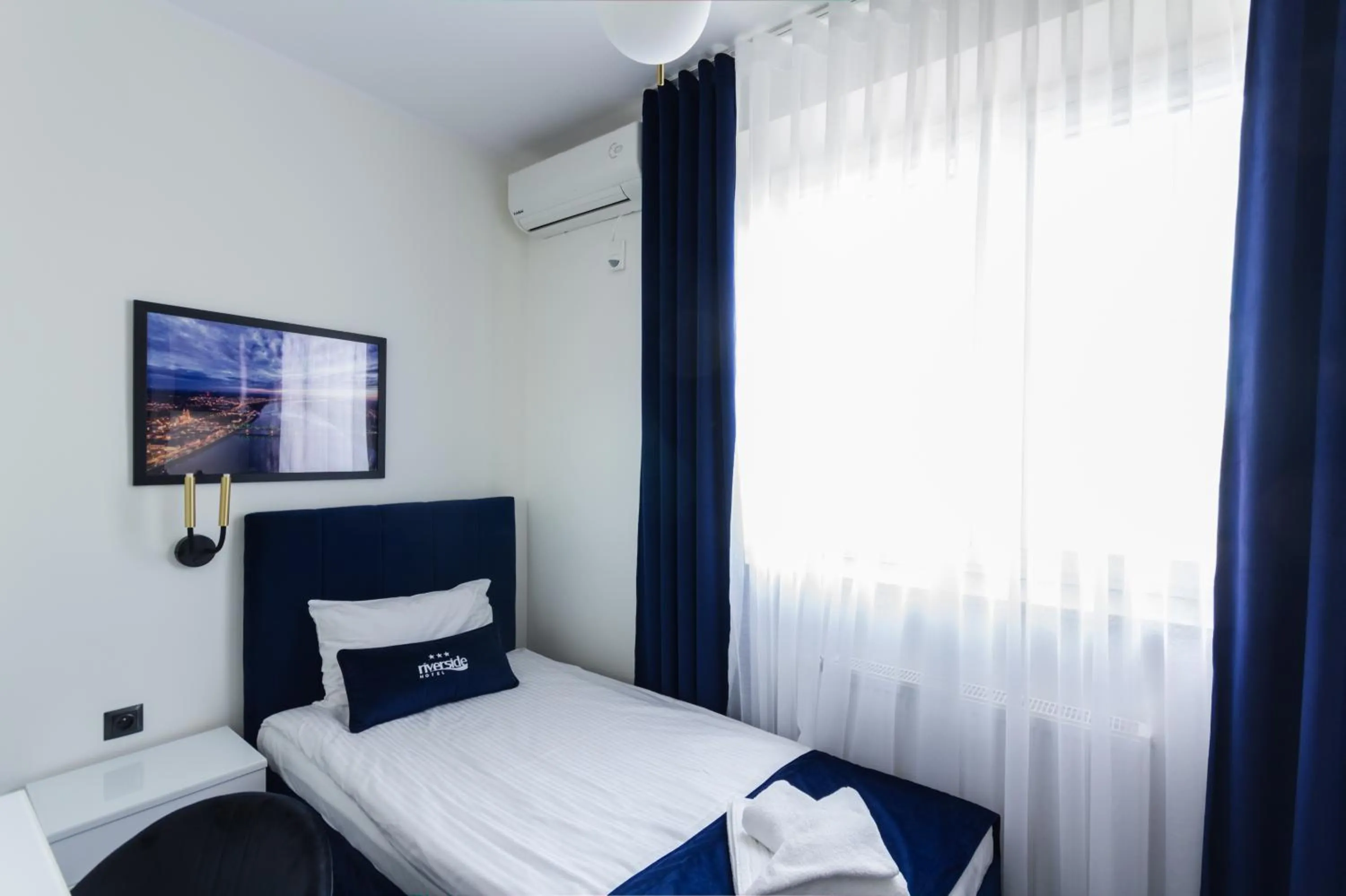 Bed in Riverside Hotel