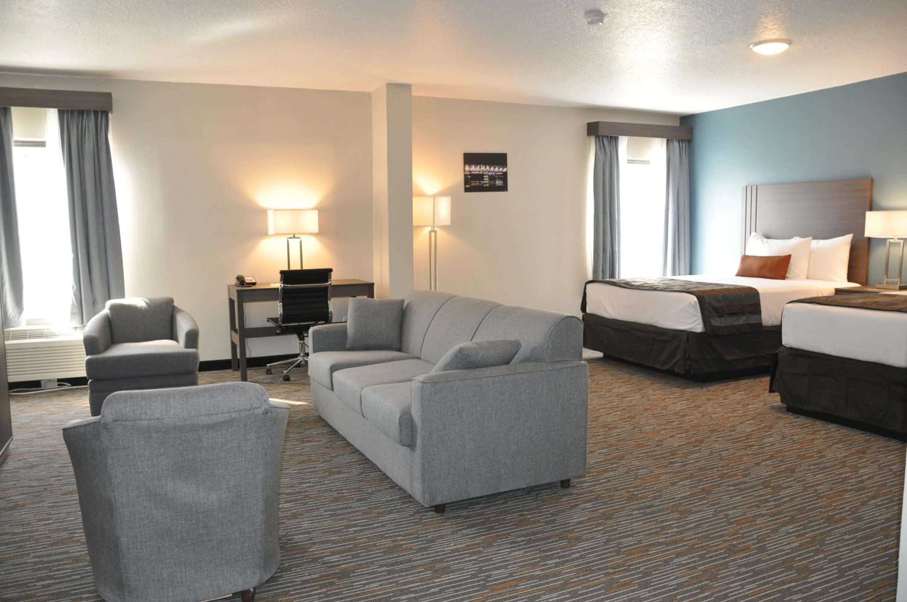 Seating area, Bed in Nobile Hotel Parkway at Celebration Orlando Very Close to Disney Theme Parks
