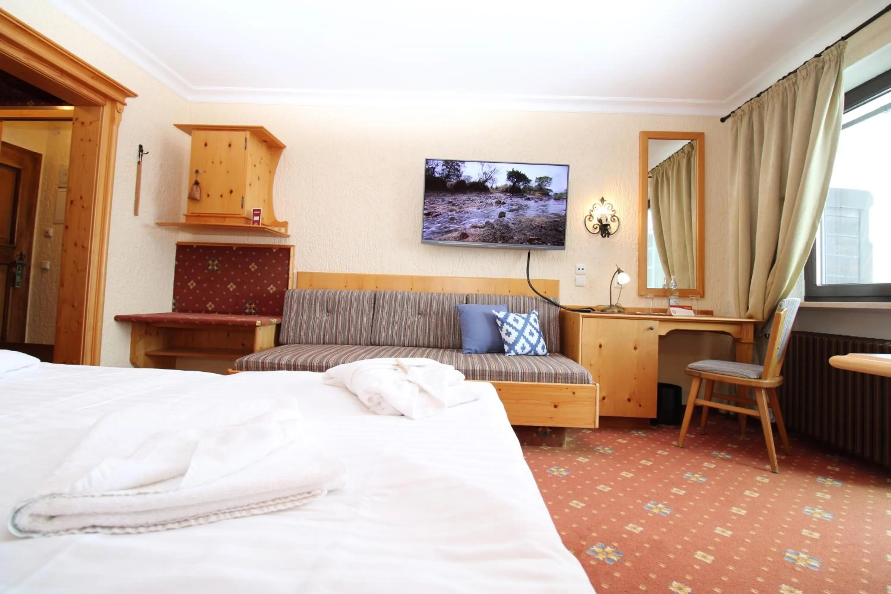 Seating area, Bed in Hotel & Residence Hochriegel