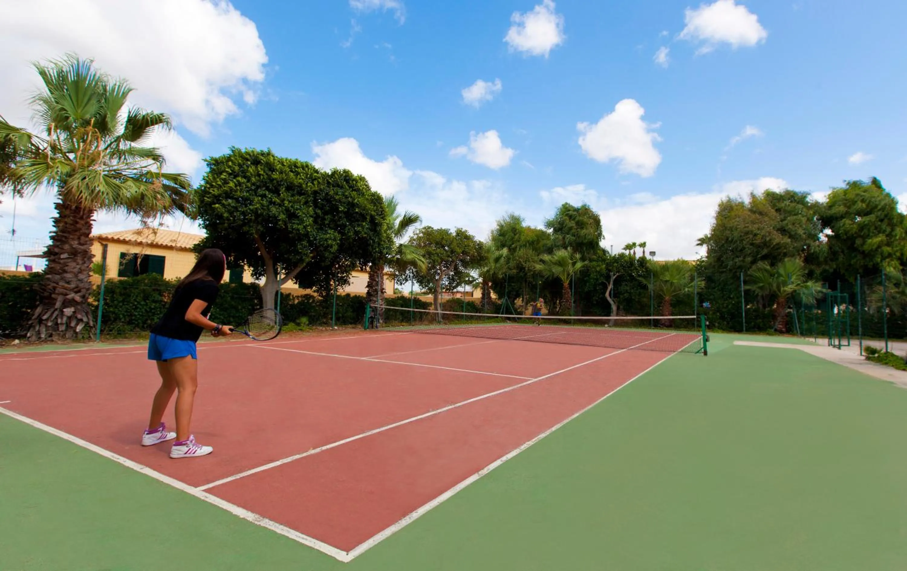 Tennis court in Delfino Beach Hotel