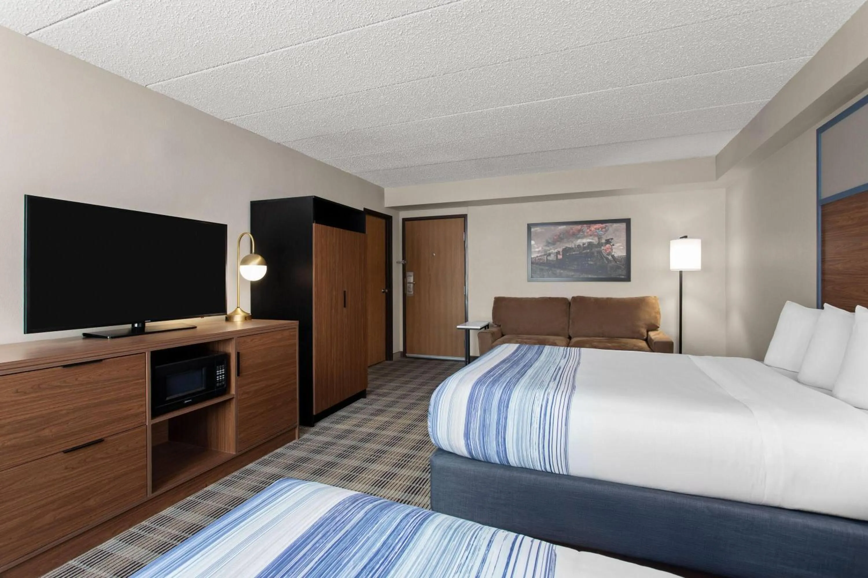 Photo of the whole room, Bed in AmericInn by Wyndham Roseau