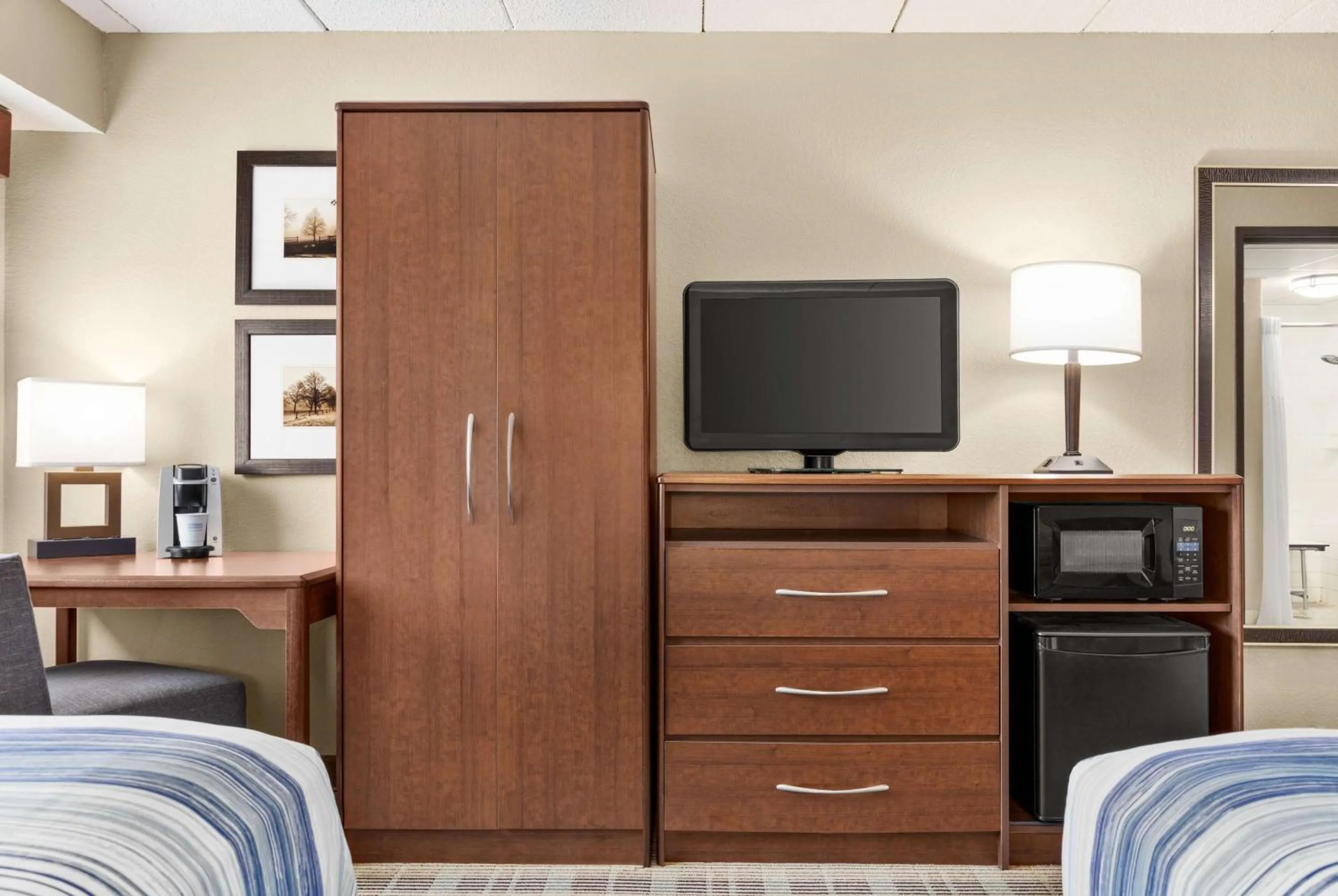 Bed in AmericInn by Wyndham Roseau