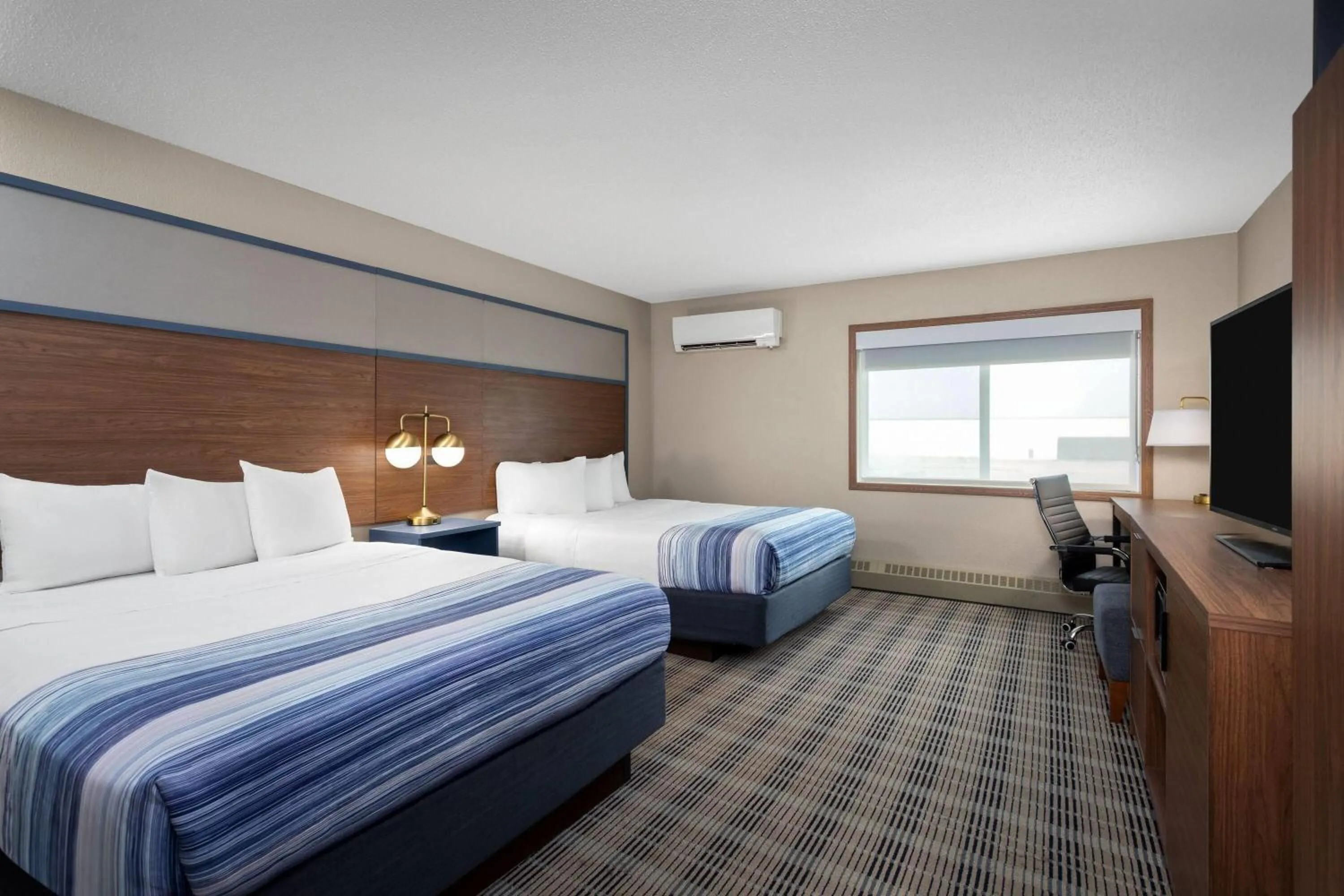 Photo of the whole room, Bed in AmericInn by Wyndham Roseau