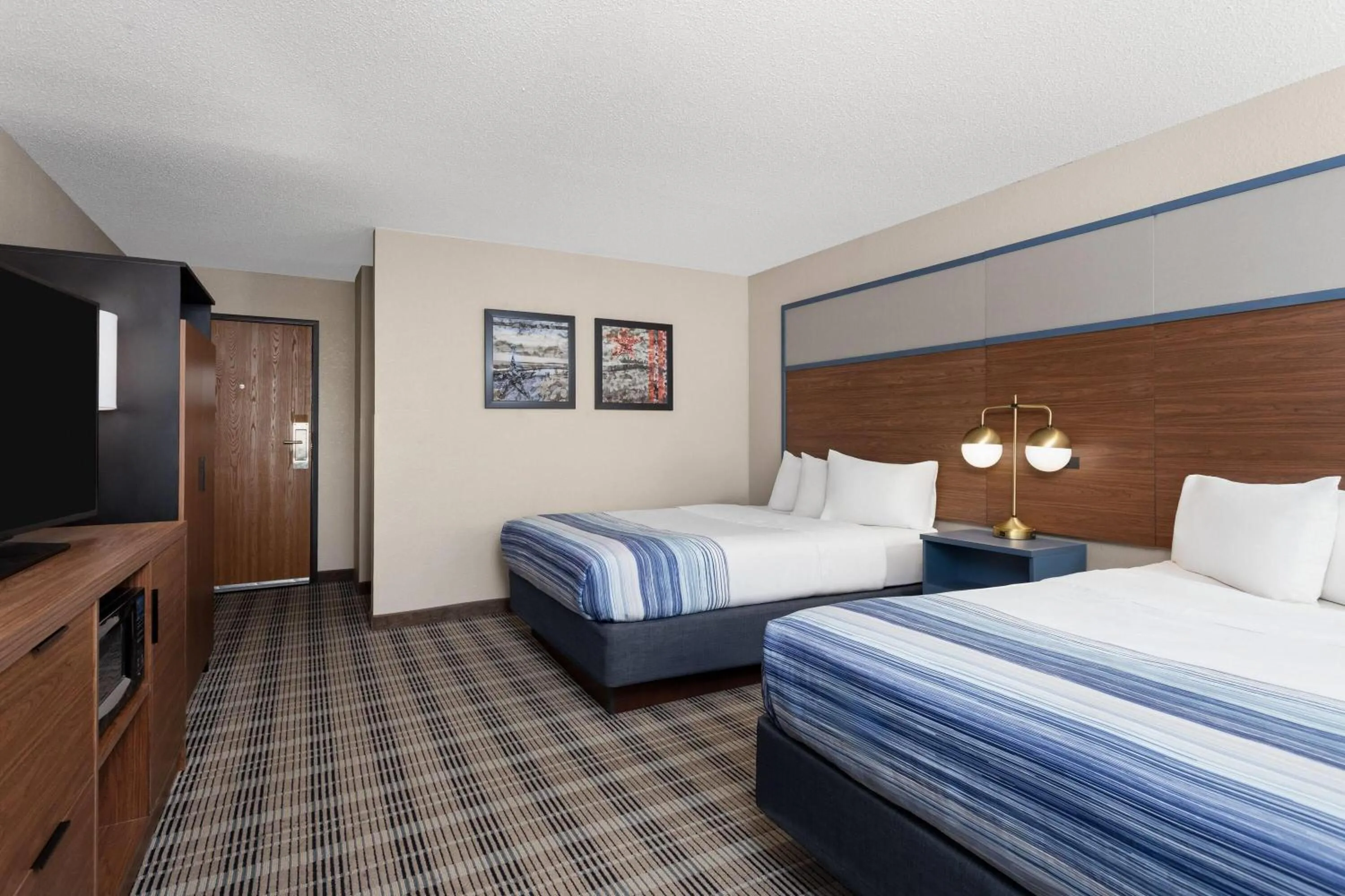 Photo of the whole room, Bed in AmericInn by Wyndham Roseau