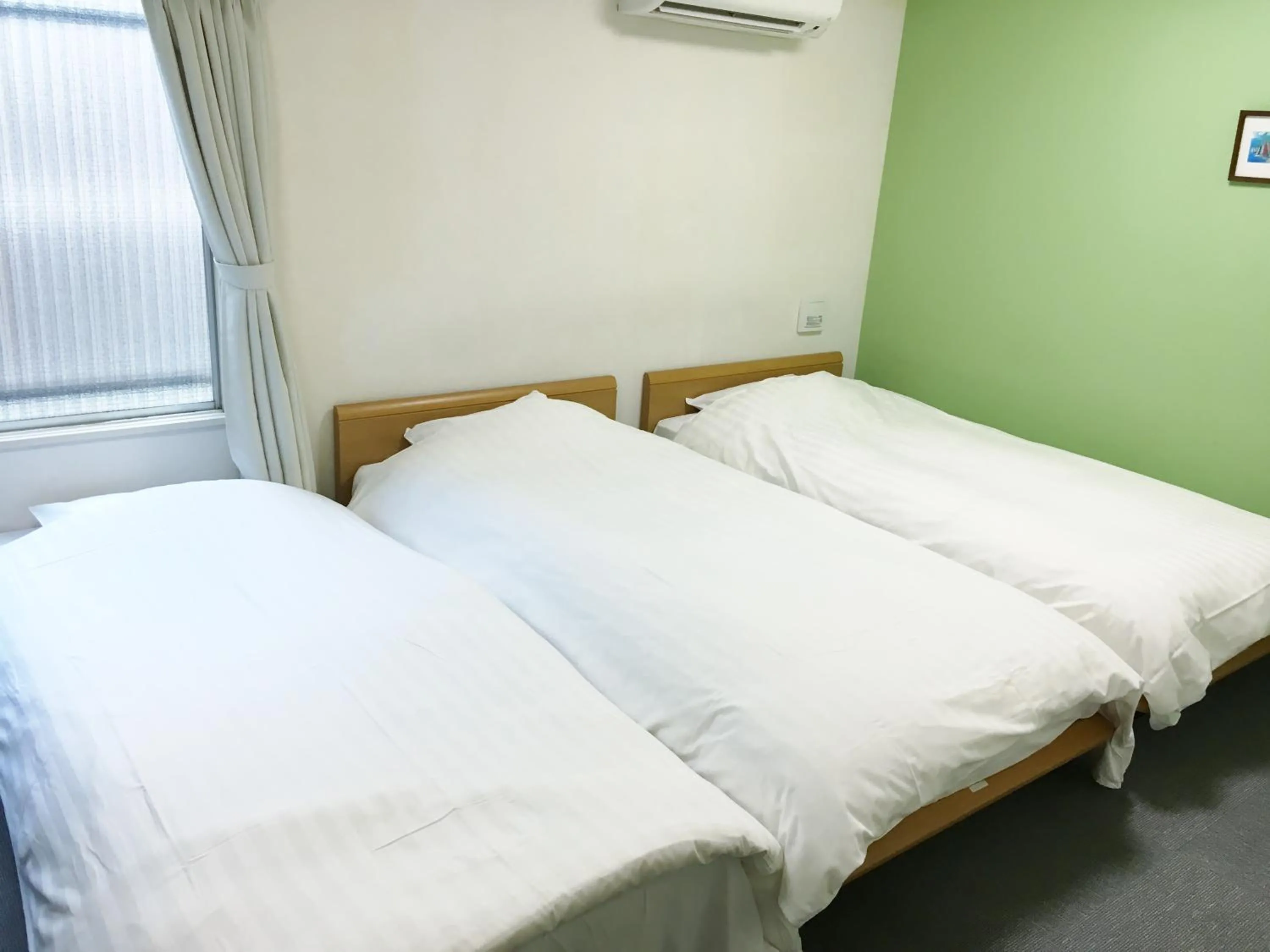 Bed in Shin-Okubo City Hotel