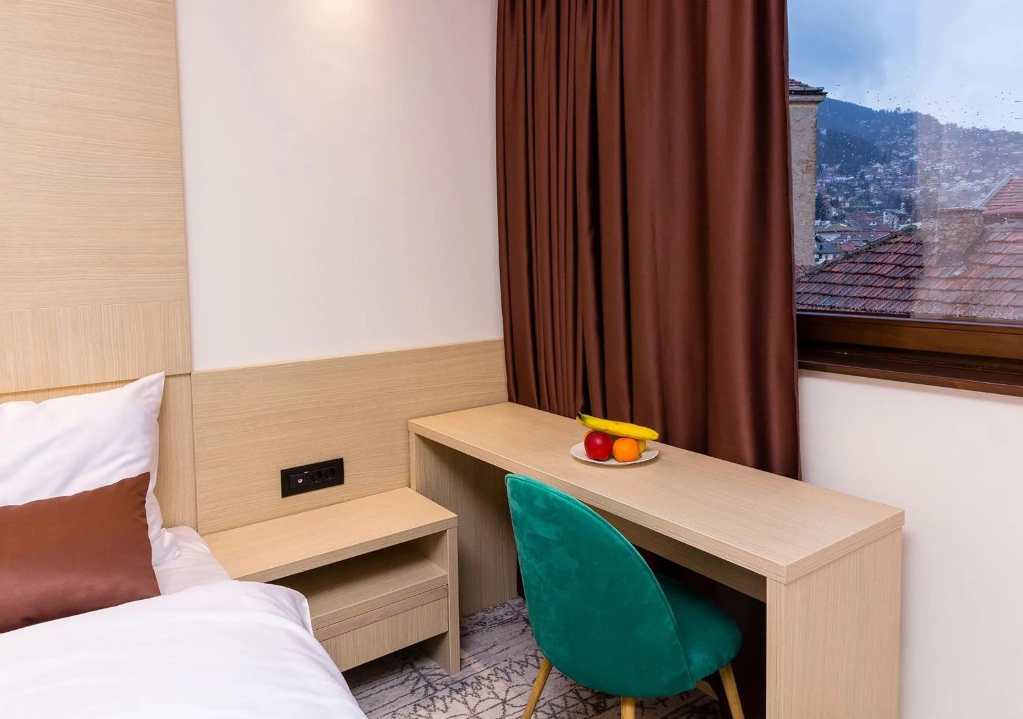 Seating area, Bed in Hotel Boss