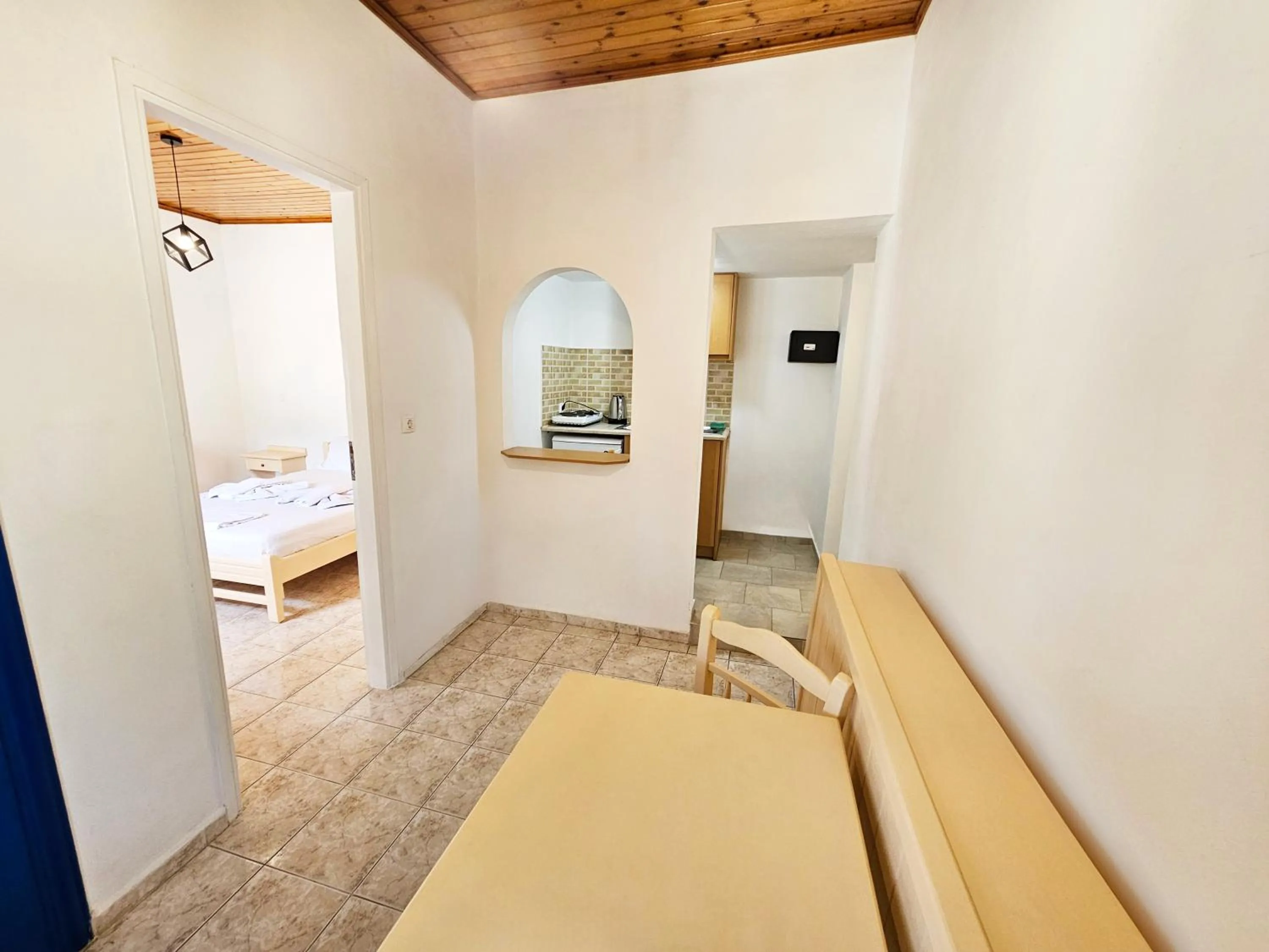 Bed in Pavlis Studios Kampos