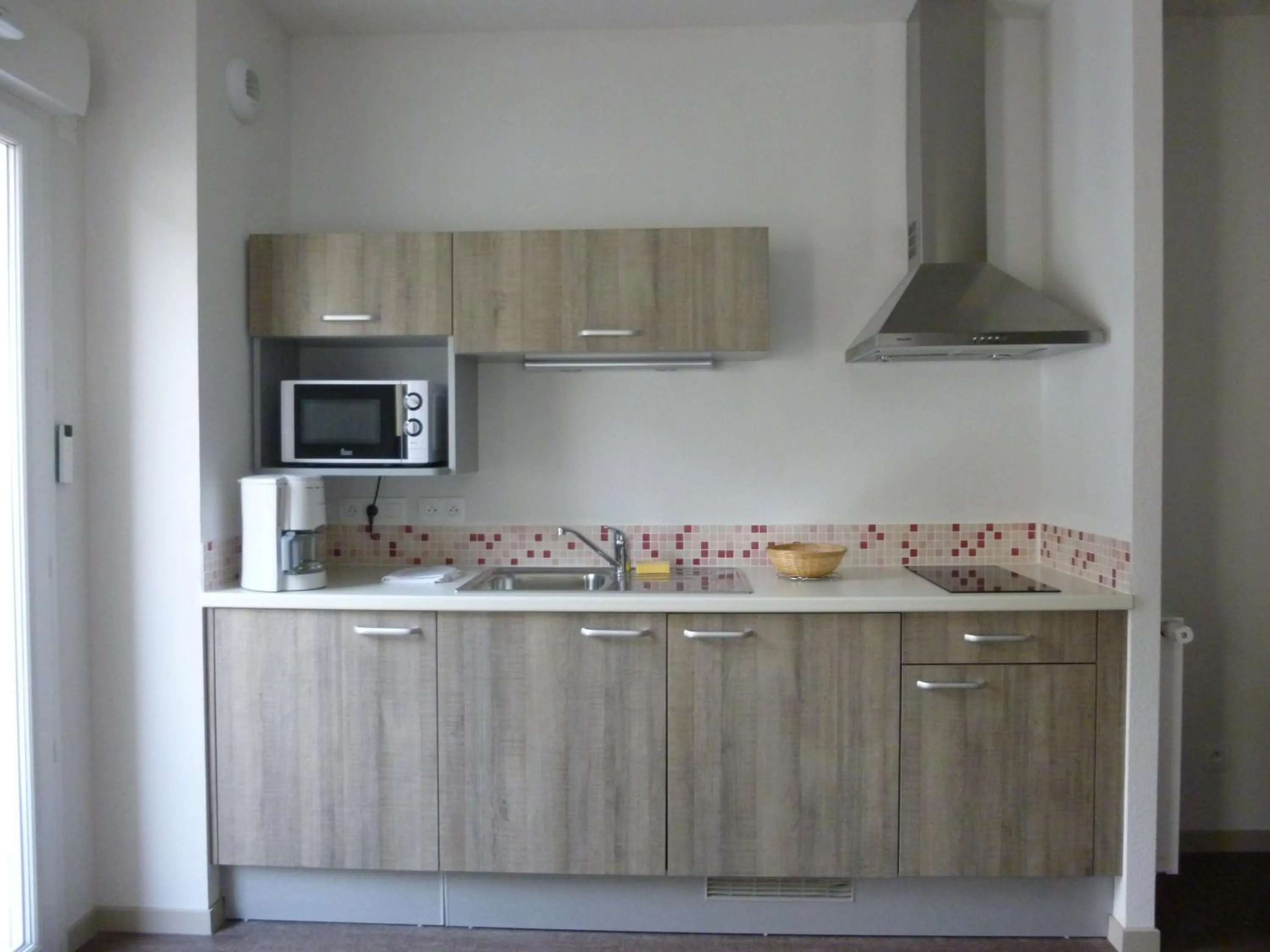 Kitchen or kitchenette in La Résidence Therm’Appart