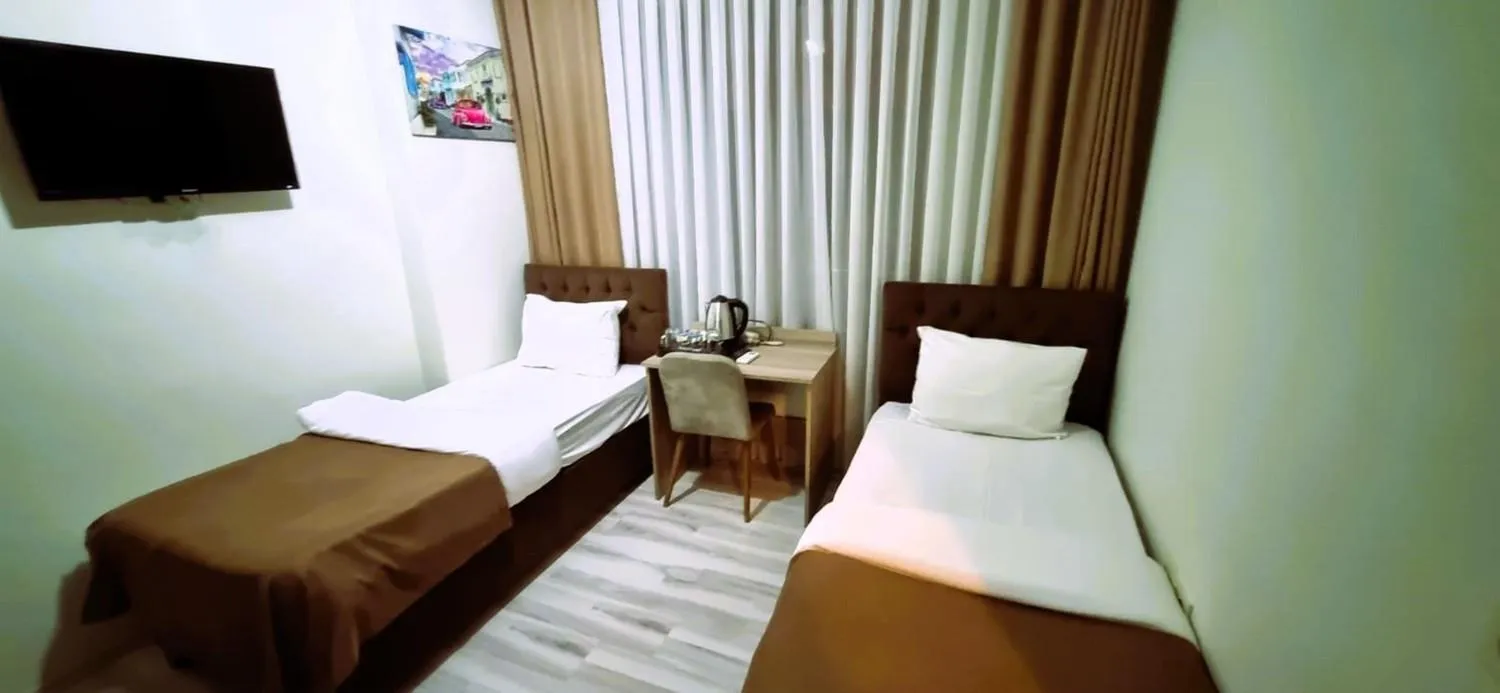 Bed in WİND HOTEL
