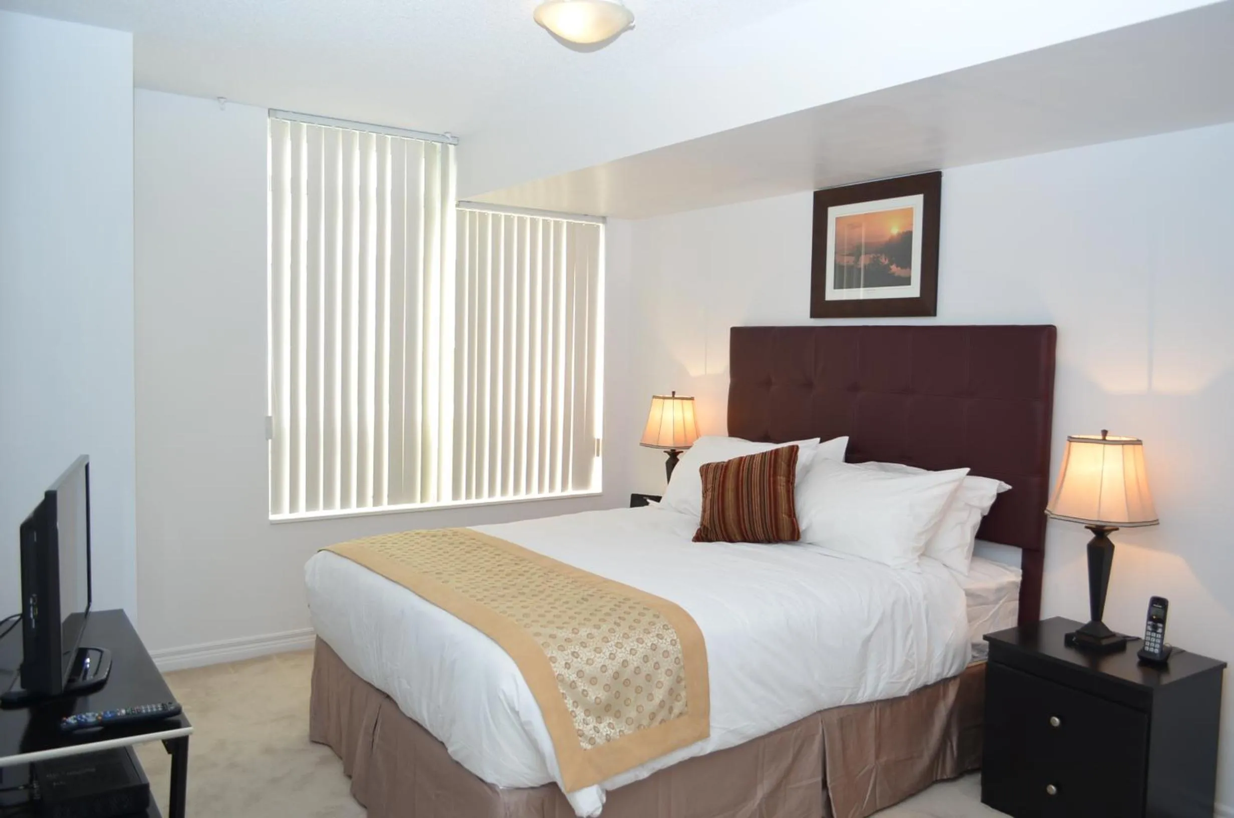 Photo of the whole room, Bed in Bombay Suites Mississauga