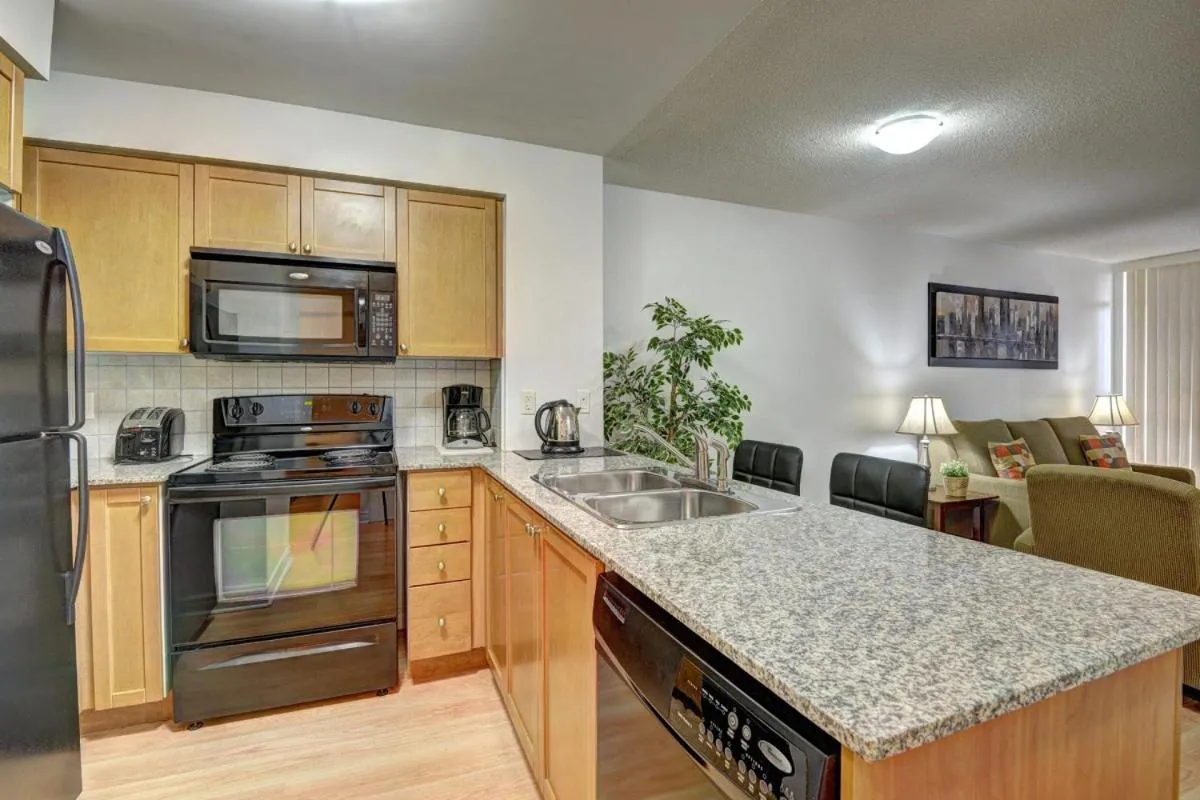 Kitchen or kitchenette in Bombay Suites Mississauga