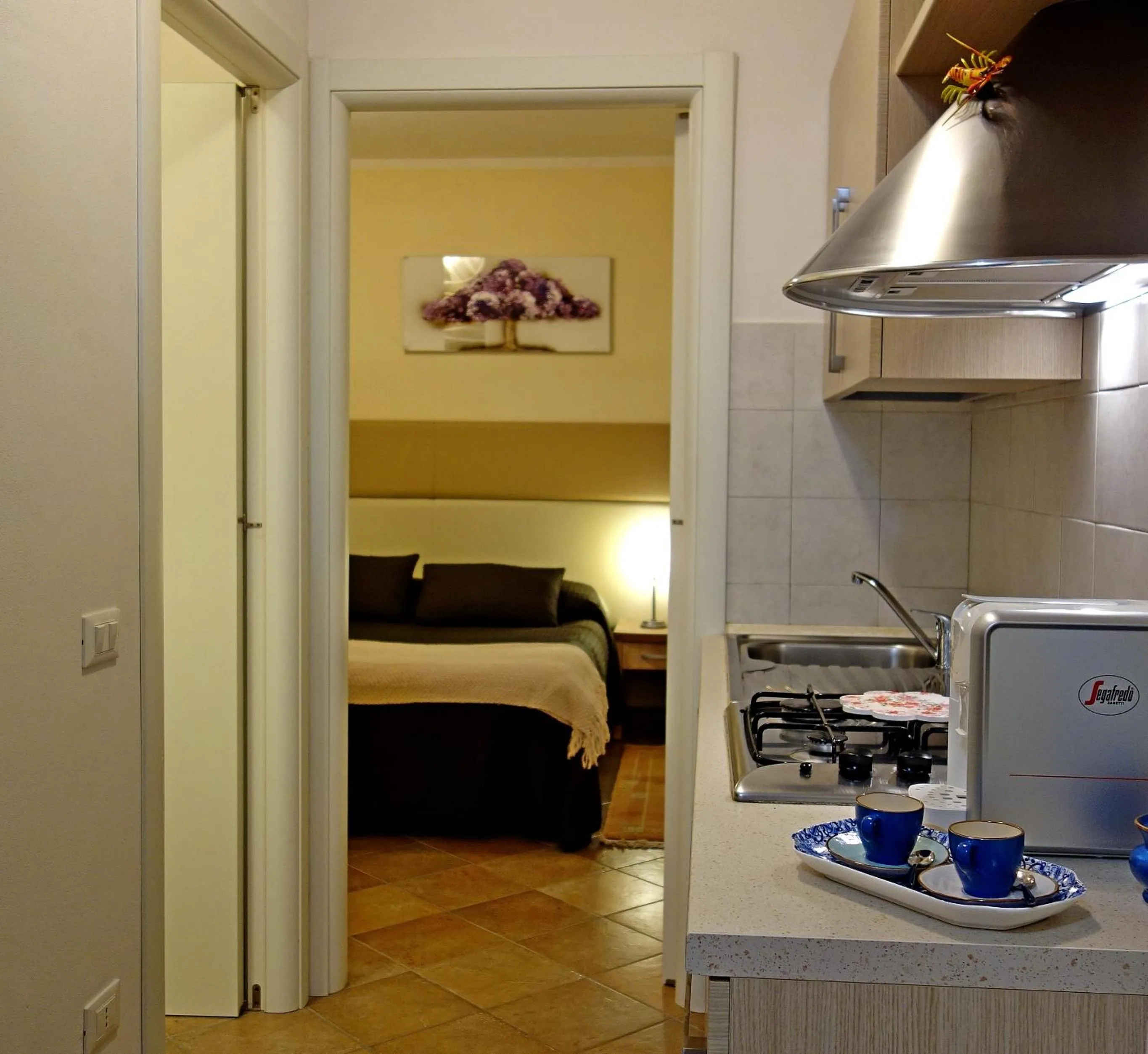 Kitchen or kitchenette, Bed in Eden Park Resort