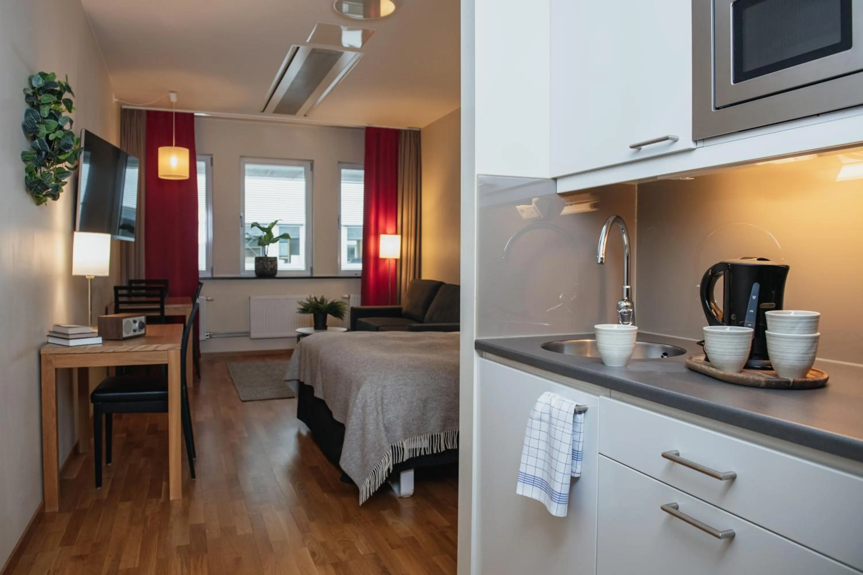 Kitchen or kitchenette, Bed in Home Hotel Mektagonen