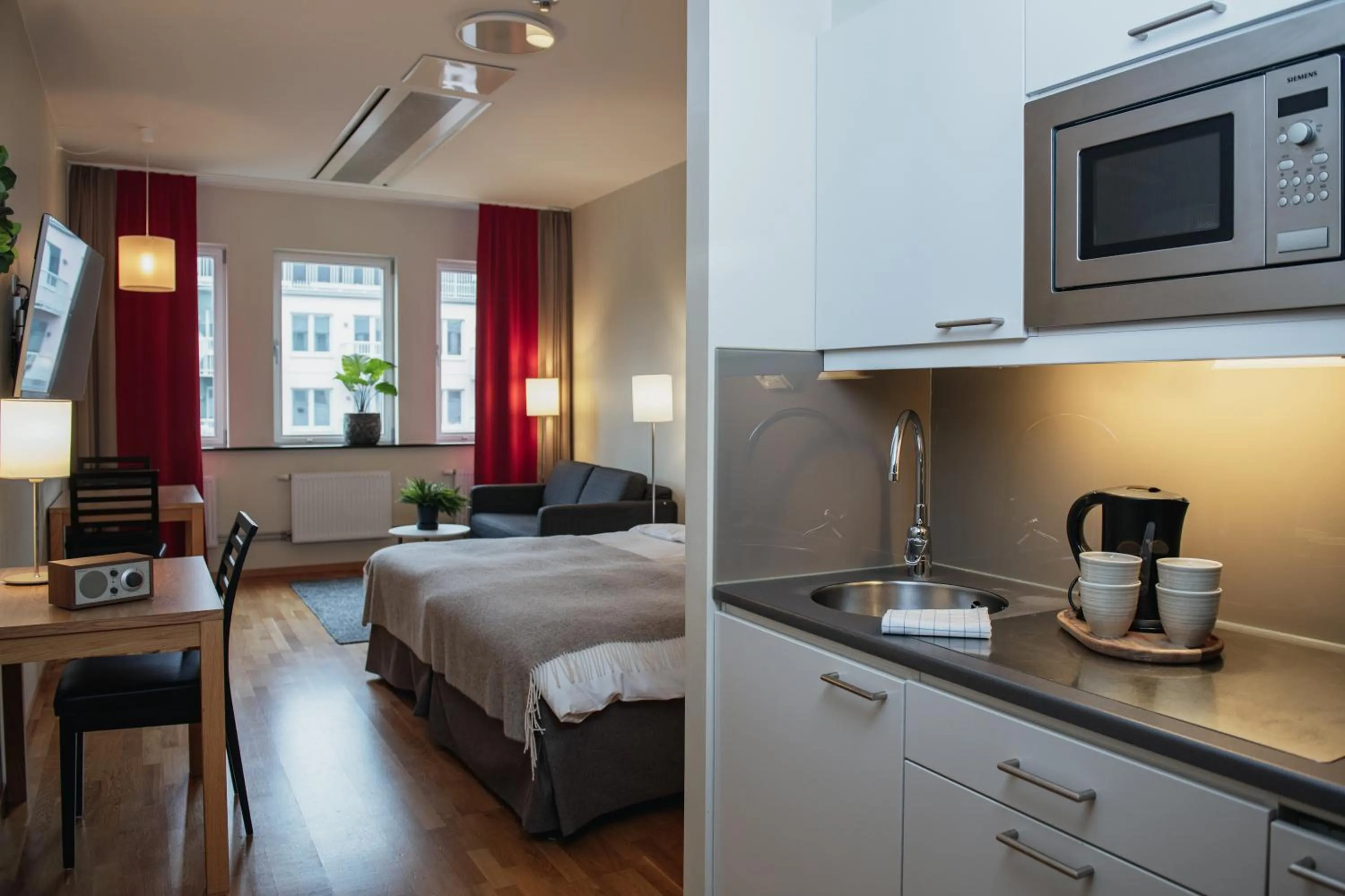 Kitchen or kitchenette, Bed in Home Hotel Mektagonen