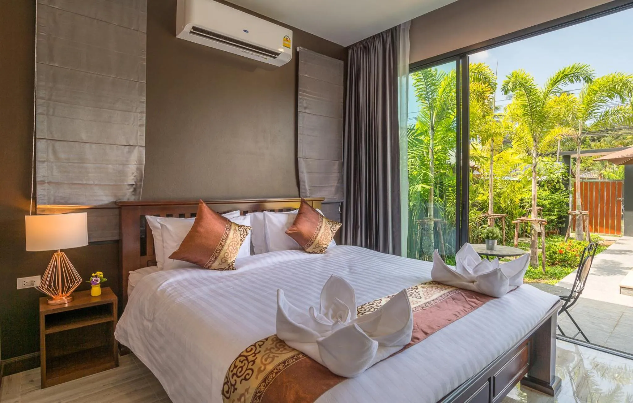 Bed in De Nathai Private Pool Villa