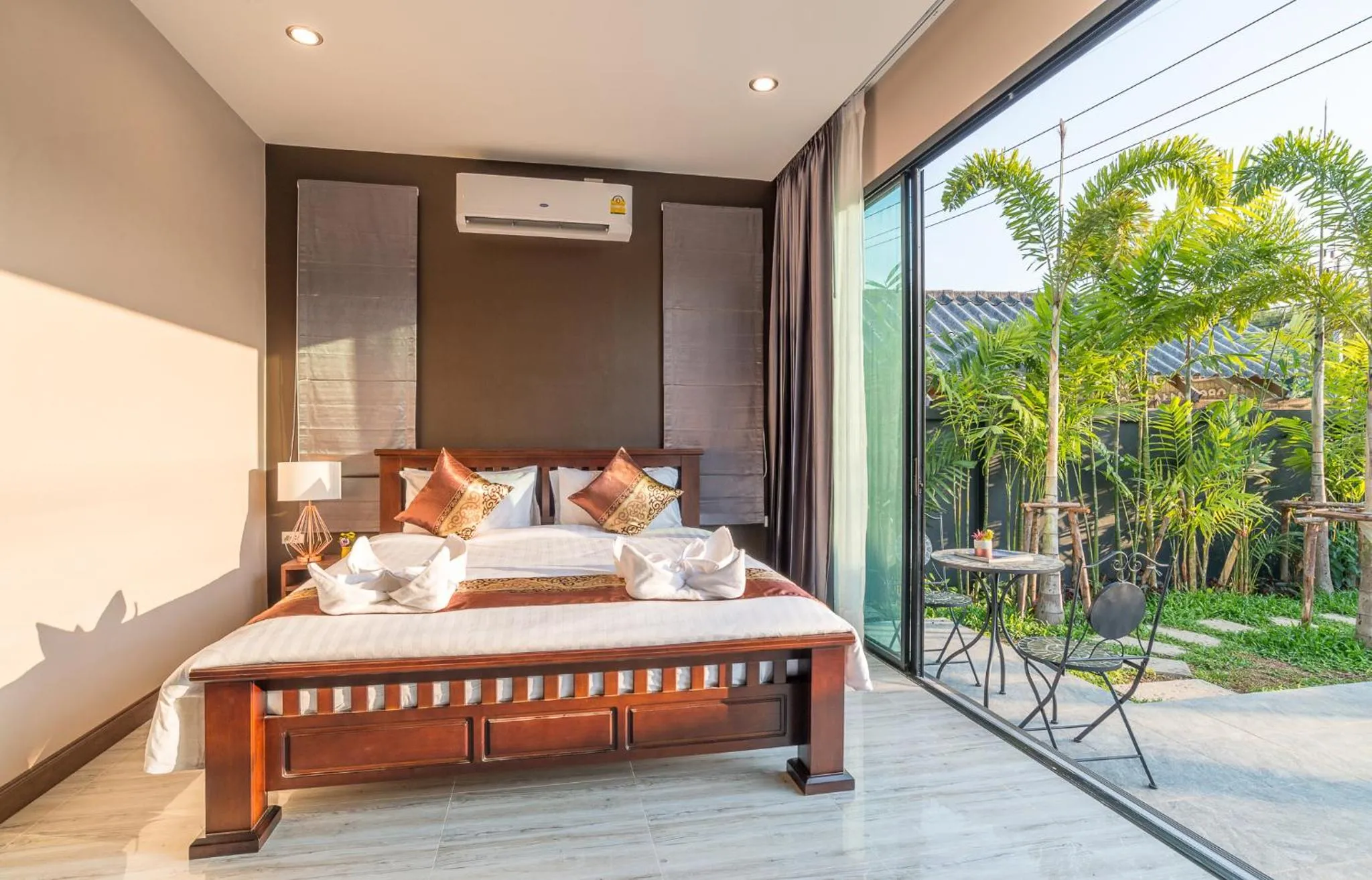 Bed in De Nathai Private Pool Villa