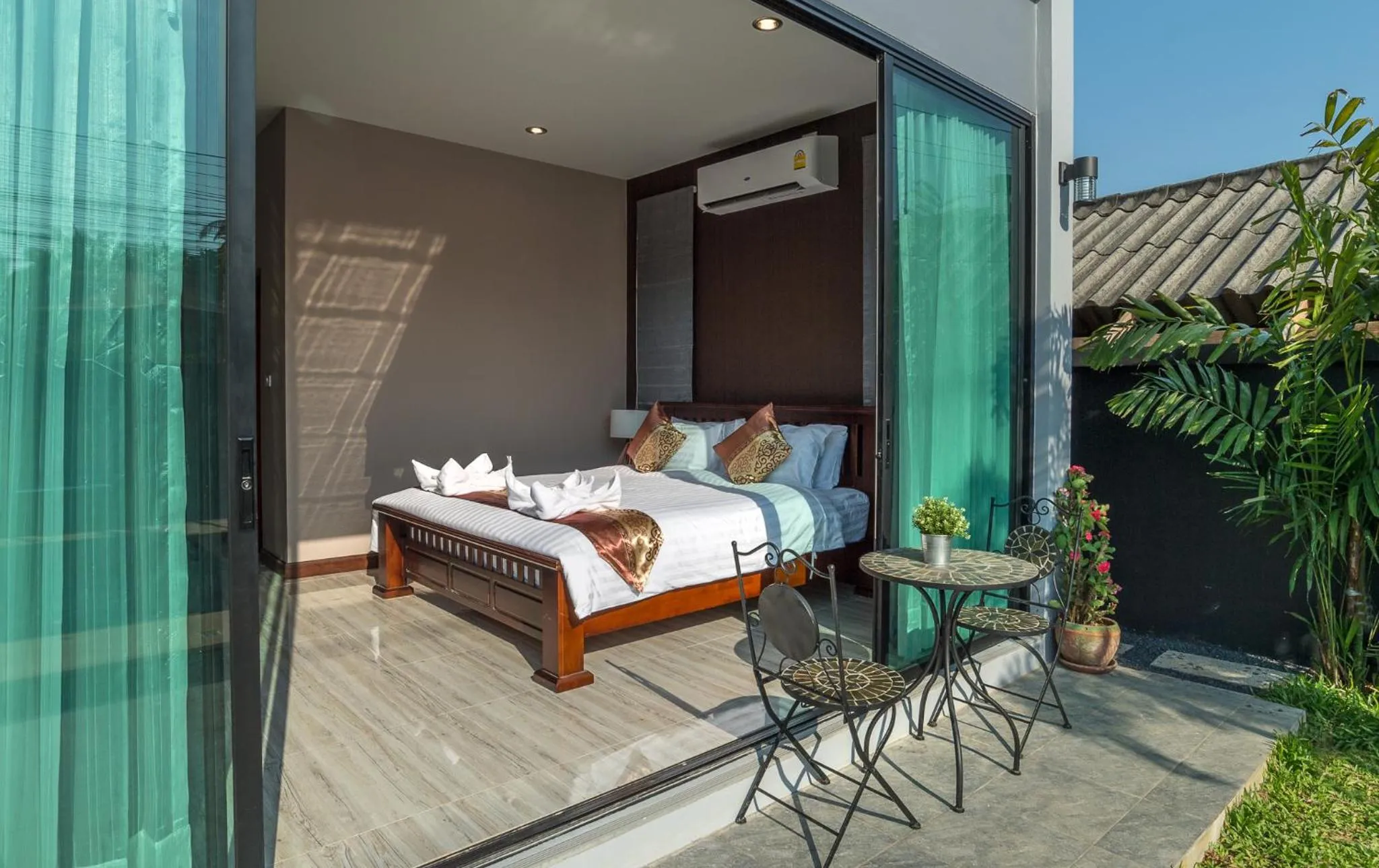 Bed in De Nathai Private Pool Villa