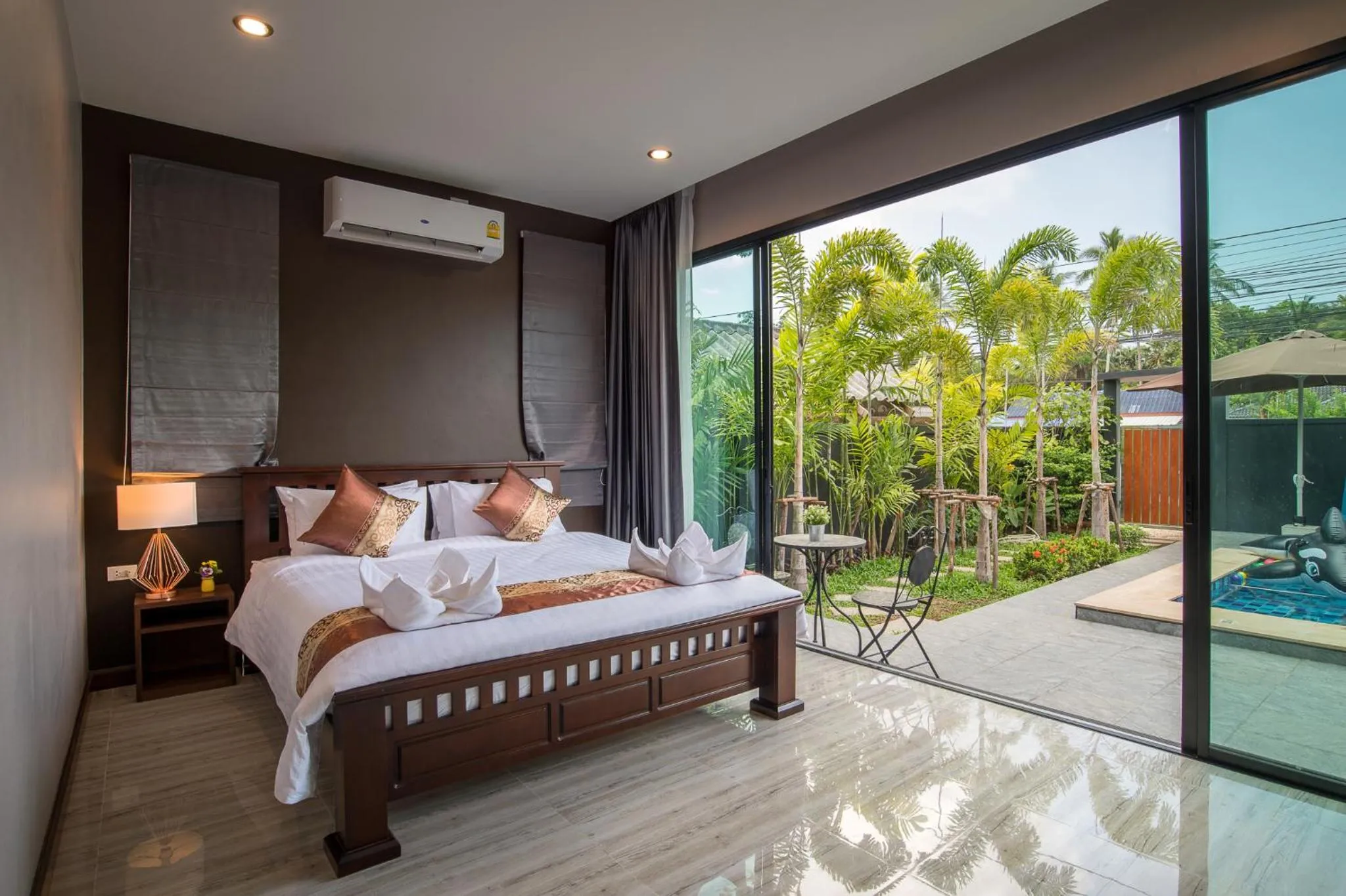Bed in De Nathai Private Pool Villa