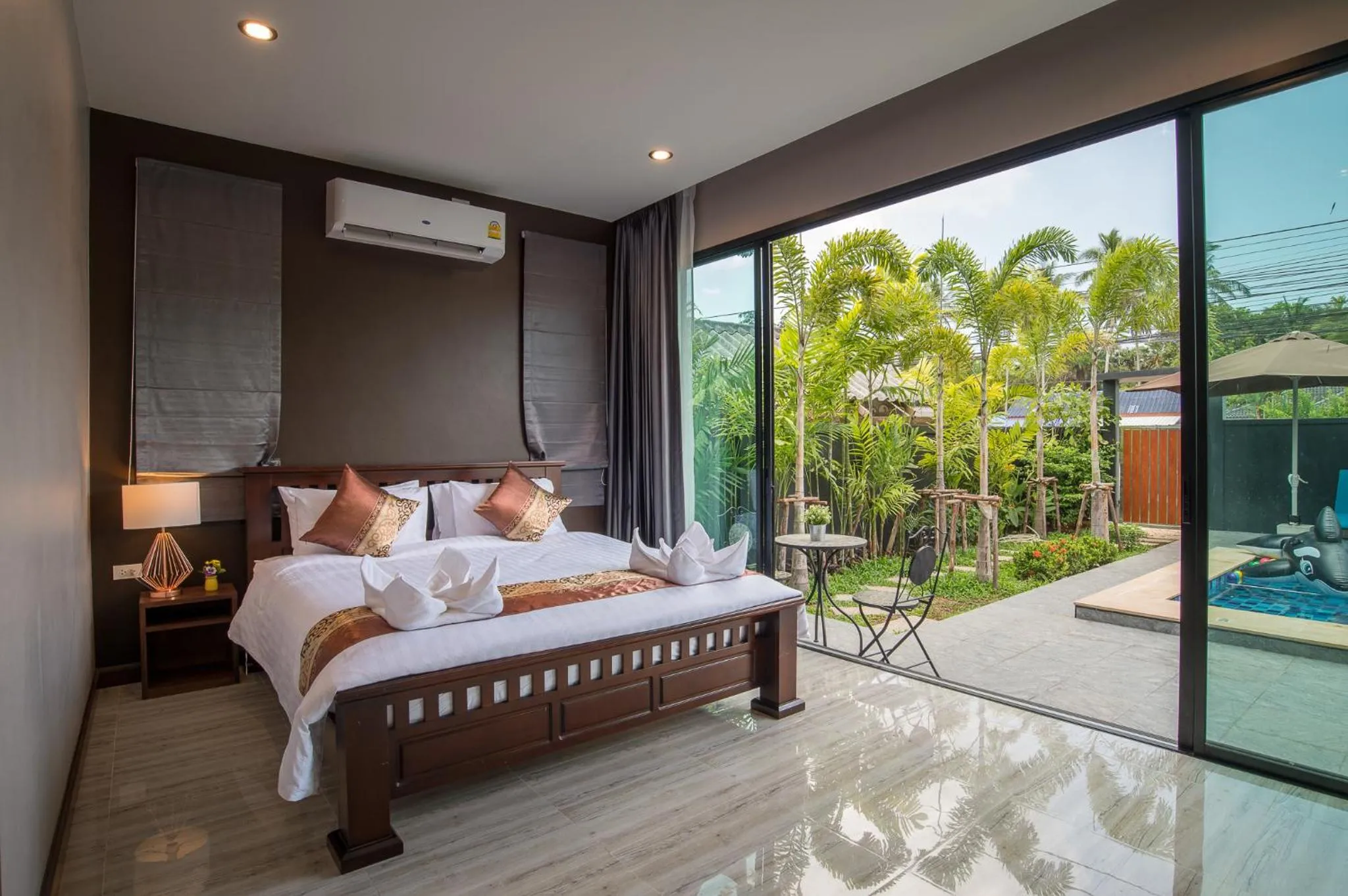 Bed in De Nathai Private Pool Villa