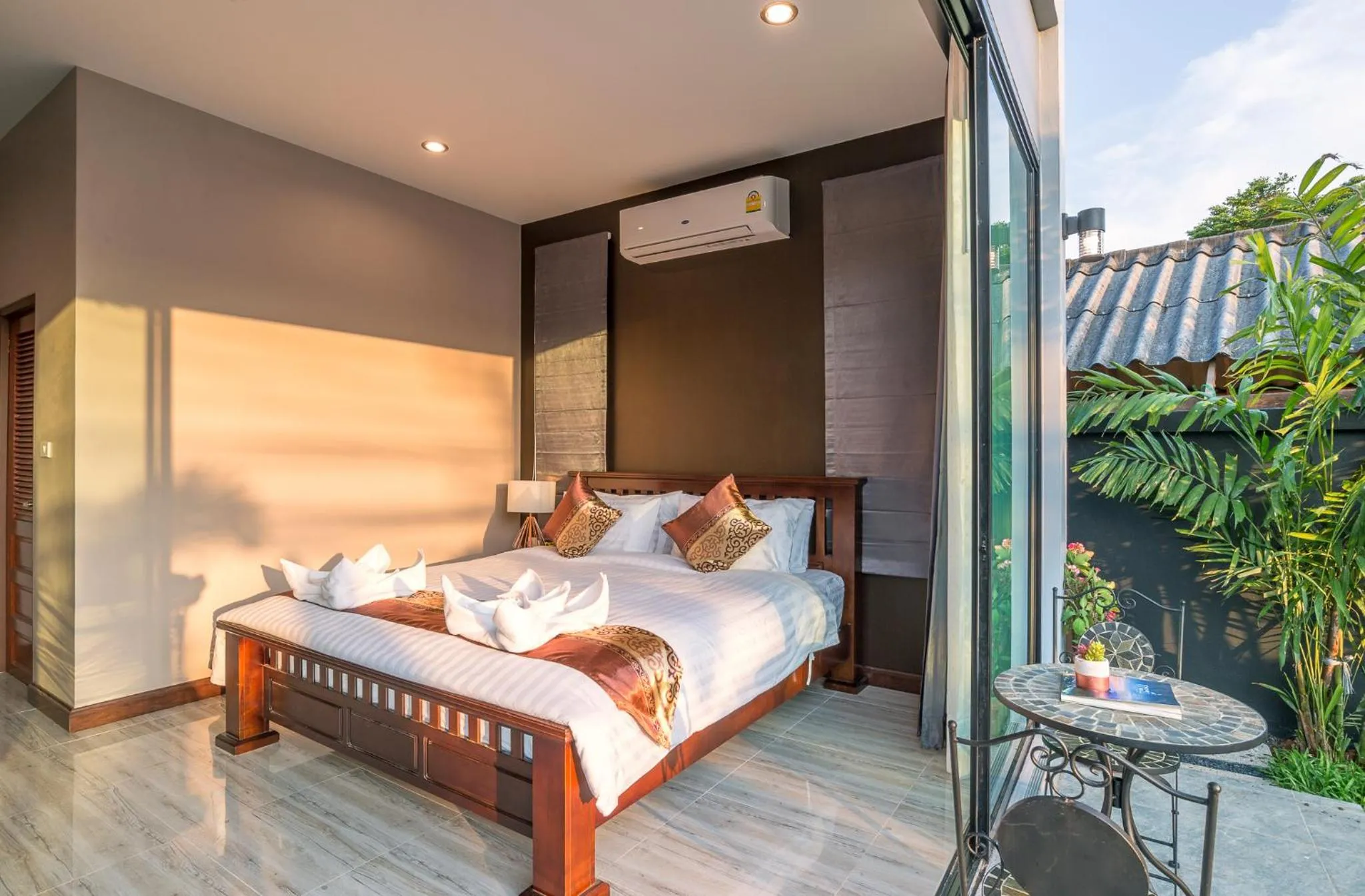 Bed in De Nathai Private Pool Villa