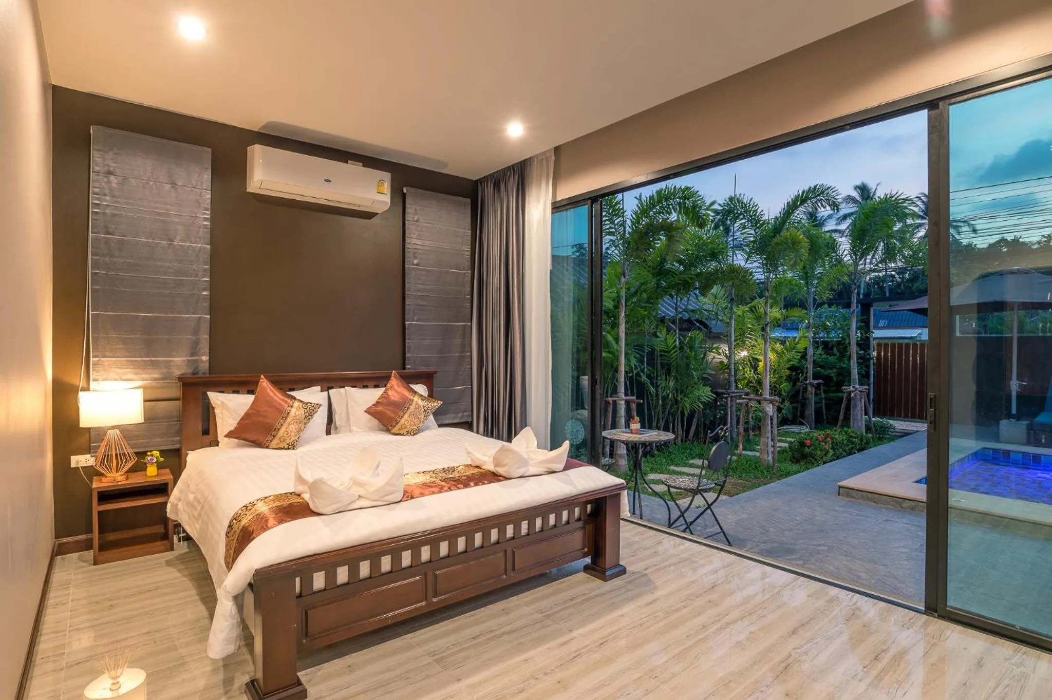 Bed in De Nathai Private Pool Villa