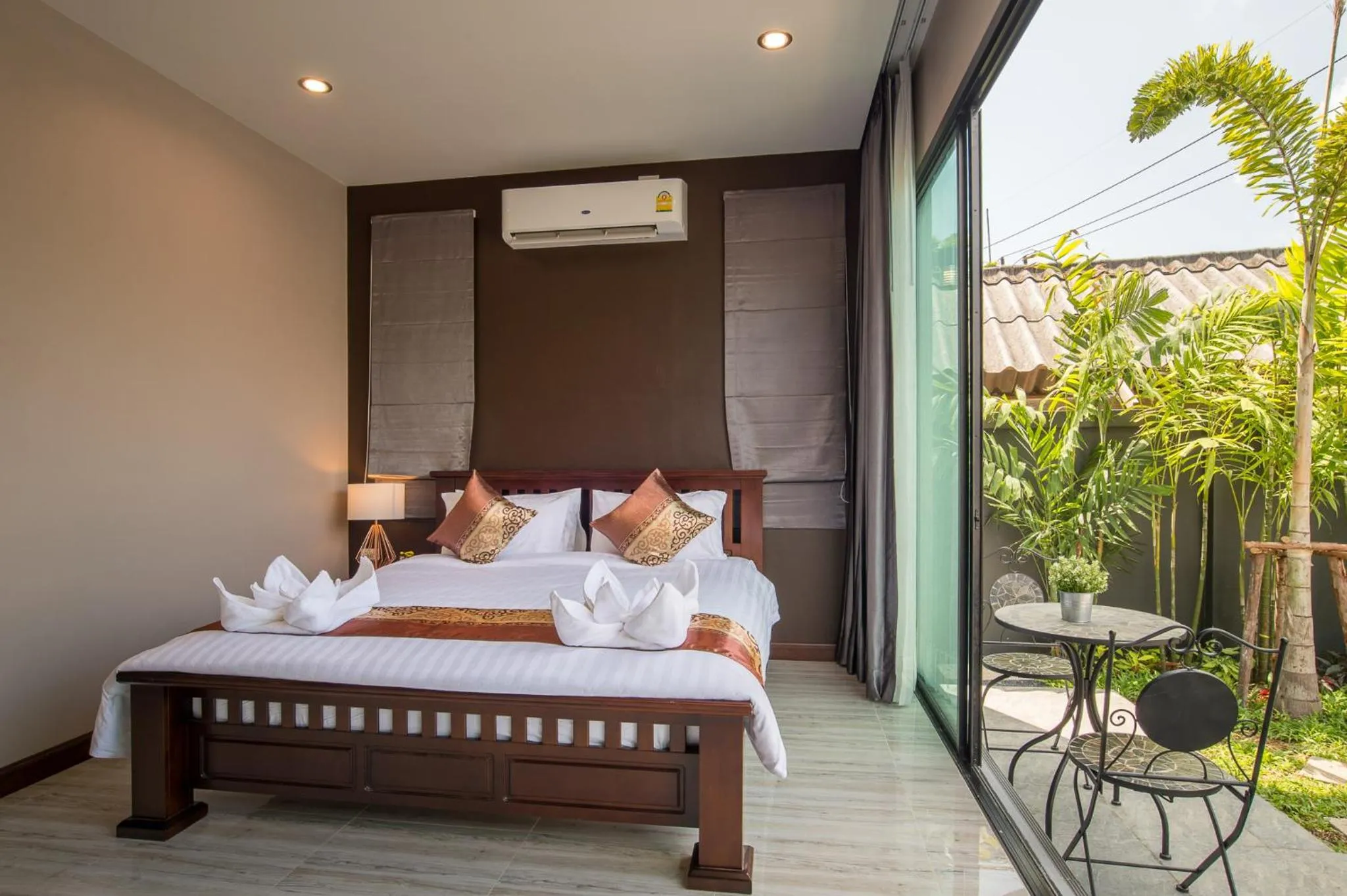 Bed in De Nathai Private Pool Villa