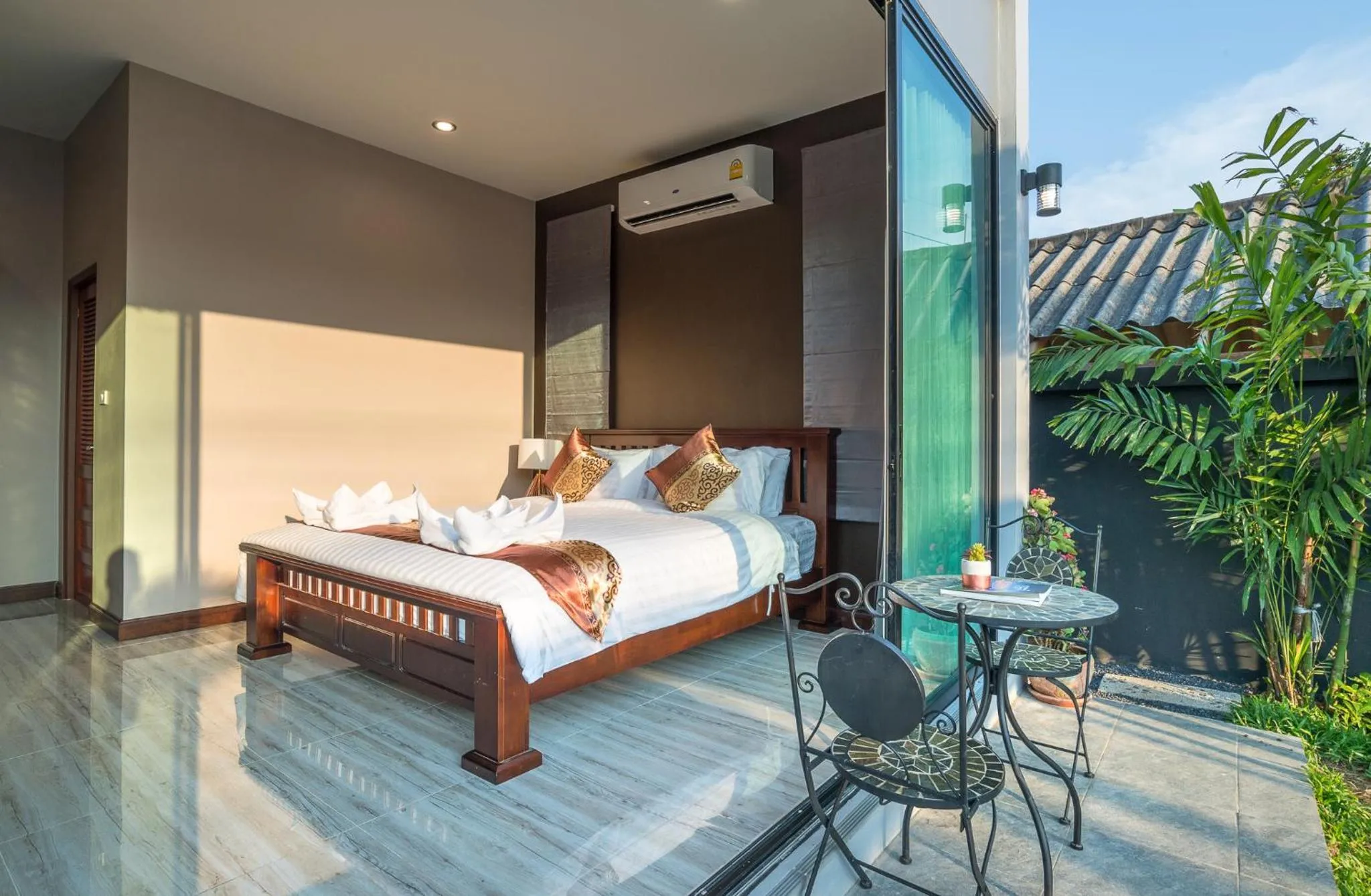 Bed in De Nathai Private Pool Villa