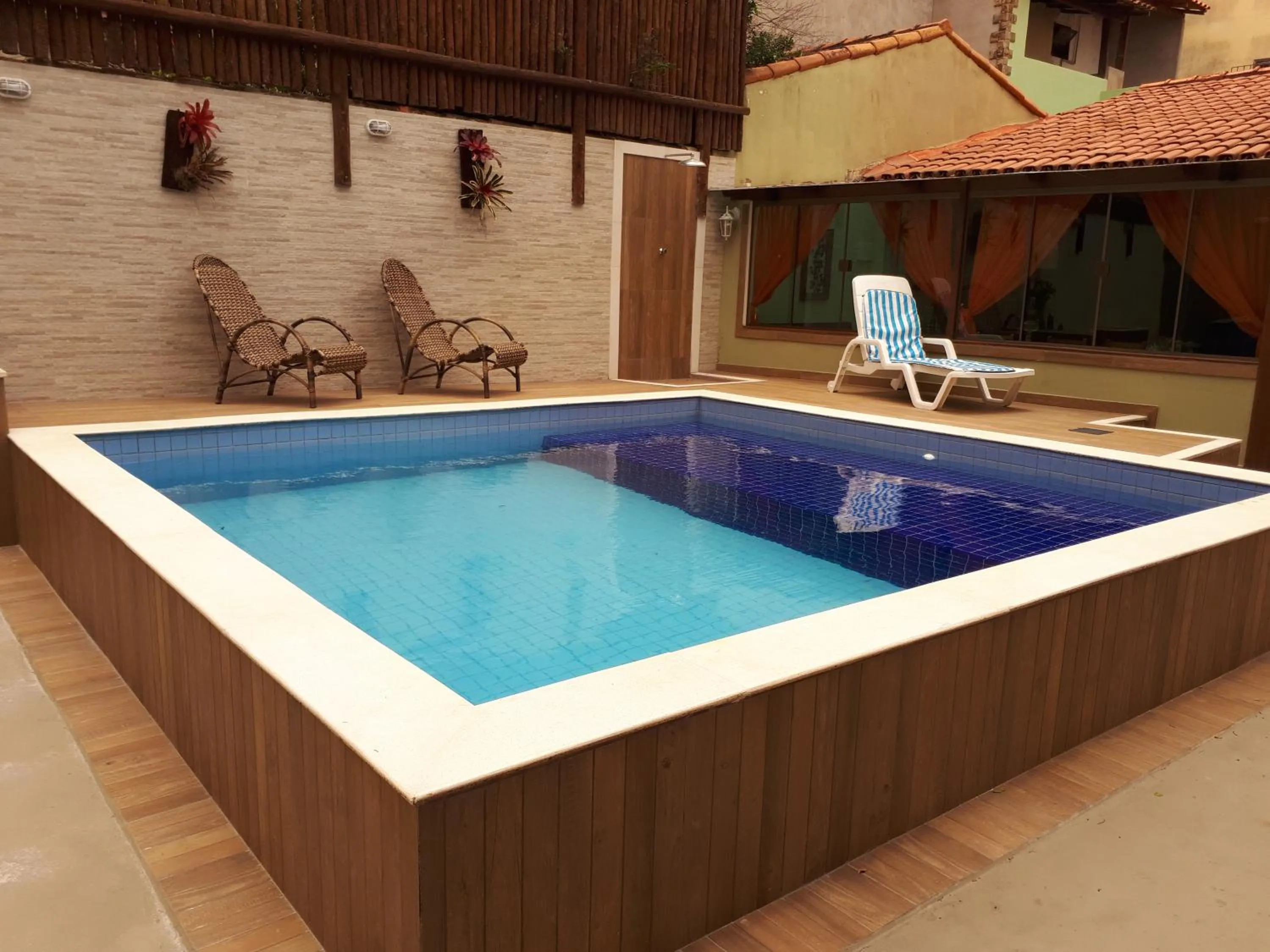 Swimming pool in Pousada Encantos do Peró