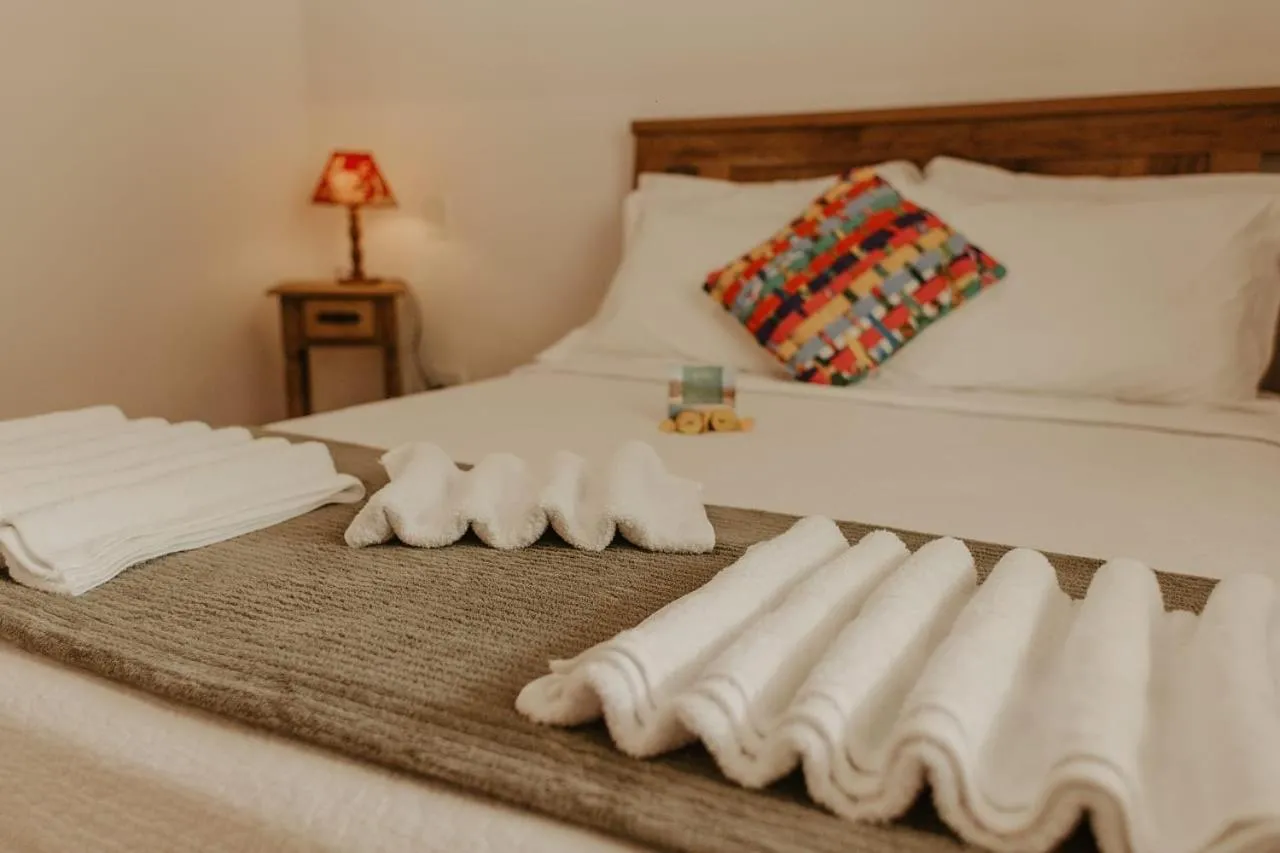 Bed in Pousada Encantos do Peró