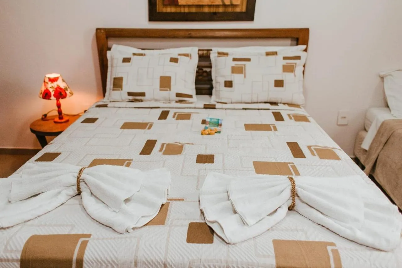 Bed in Pousada Encantos do Peró