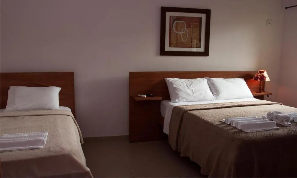 Property building, Bed in Pousada Encantos do Peró