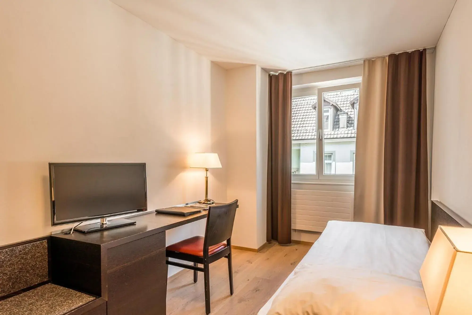 Photo of the whole room, Bed in Hotel Alpina Luzern Photo of the whole room, Bed in Hotel Alpina Luzern