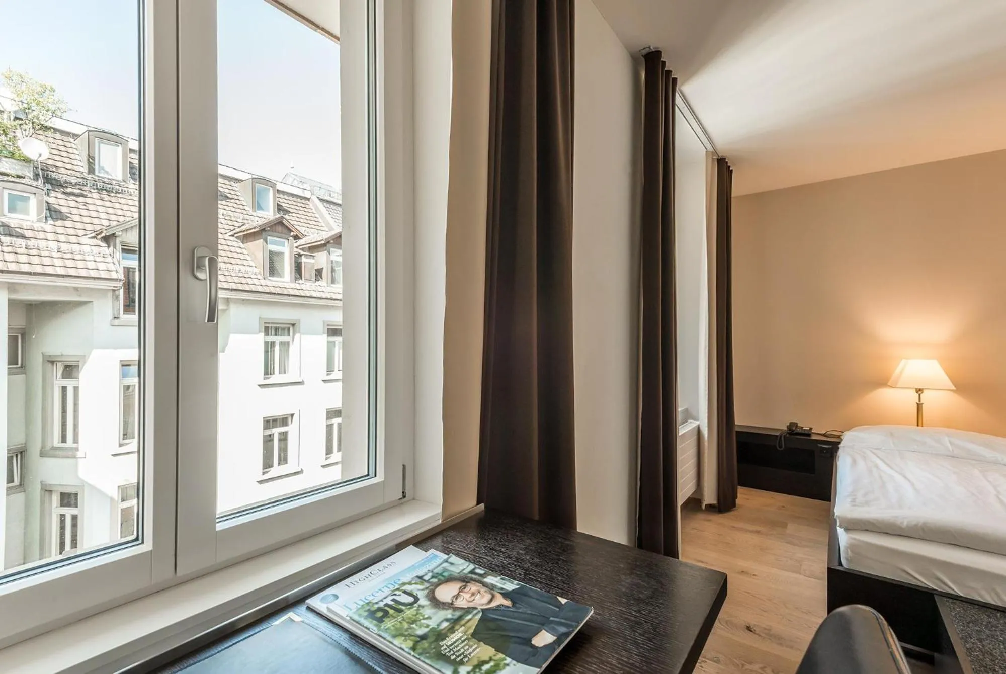 Photo of the whole room, Bed in Hotel Alpina Luzern