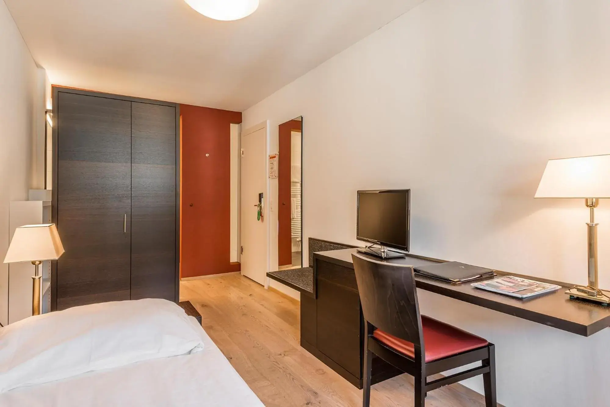 Photo of the whole room, Bed in Hotel Alpina Luzern Photo of the whole room, Bed in Hotel Alpina Luzern